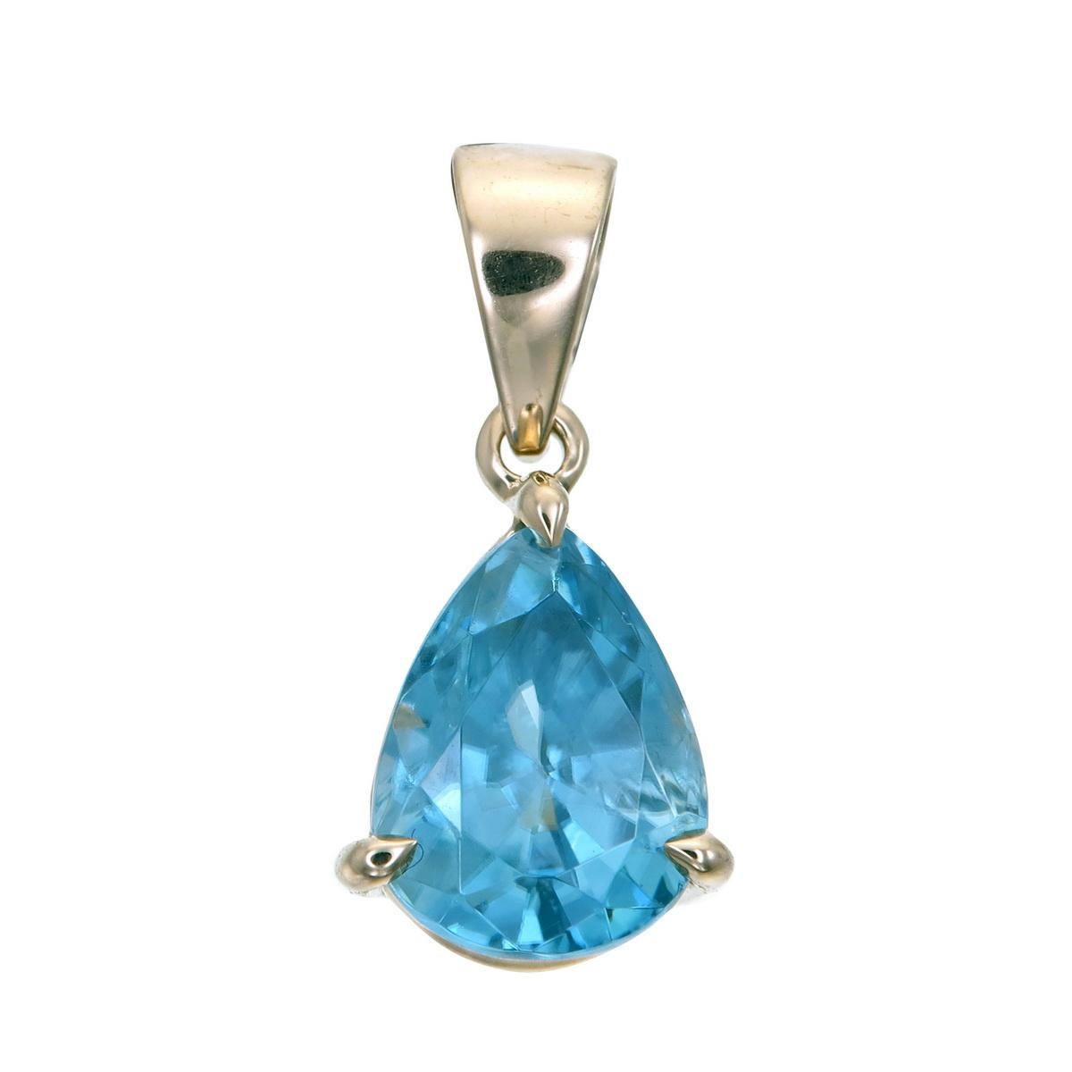 14 Karat Yellow Gold Pendant set with a 2.5. carat Natural Blue Zircon.
Featured on this piece is a metallic blue zircon mined, cut and polished in Ratanakiri, Cambodia.
The soothing light blue contrasts sensationally with the stark bright yellow