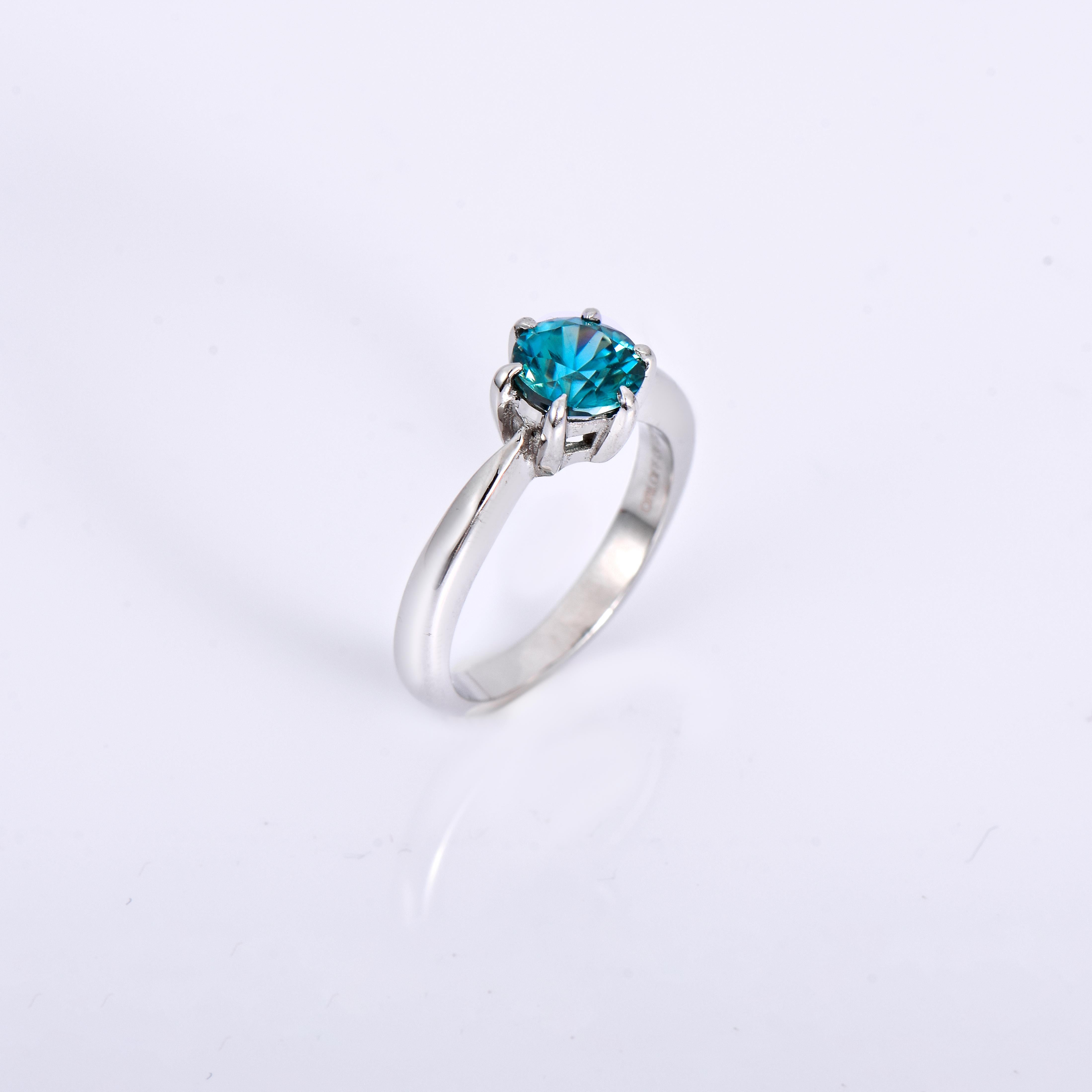 Orloff of Denmark; 925 Sterling Silver Ring set with a 1.46 carat Natural Cambodian Blue Zircon.

This piece has been meticulously hand-crafted out of 925 sterling silver.
In the center, set with 4 claw-prongs, is a gorgeous 1.46 carat blue zircon