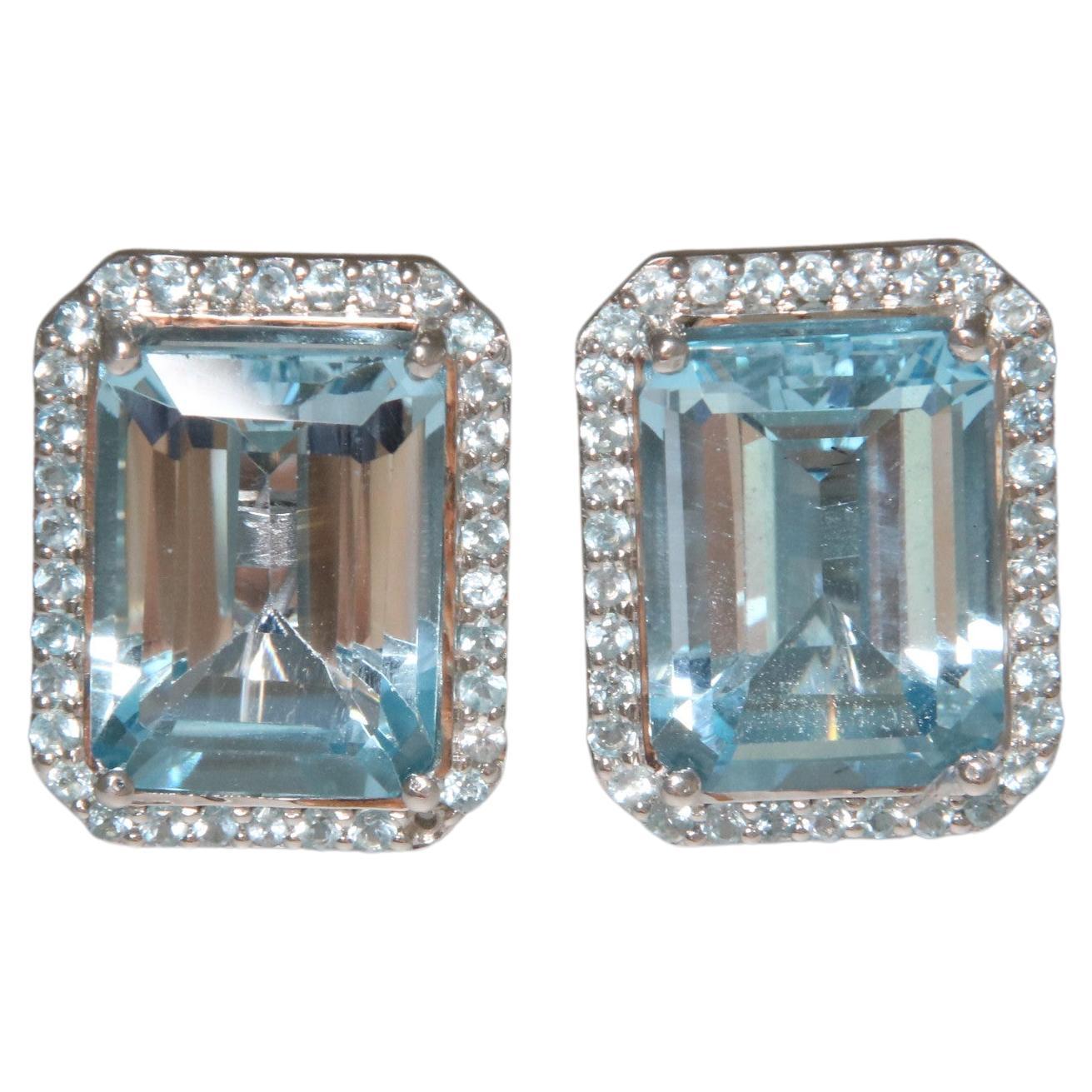 Orloff of Denmark; Blue Topaz Earrings fashioned out of 925 Sterling Silver.

This exquisite pair of earrings features radiant blue topaz gemstones, surrounded by a halo of light Swiss blue topaz, all meticulously set in 925 sterling silver. The