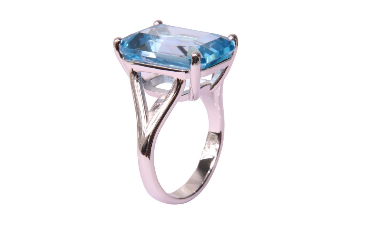 Orloff of Denmark; Sky Blue Topaz Ring Fashioned out of 925 Sterling Silver.

This elegant ring features a stunning ~15 carat sky blue topaz, set majestically in a sterling silver band. The gemstone is cut in a classic emerald style, showcasing the