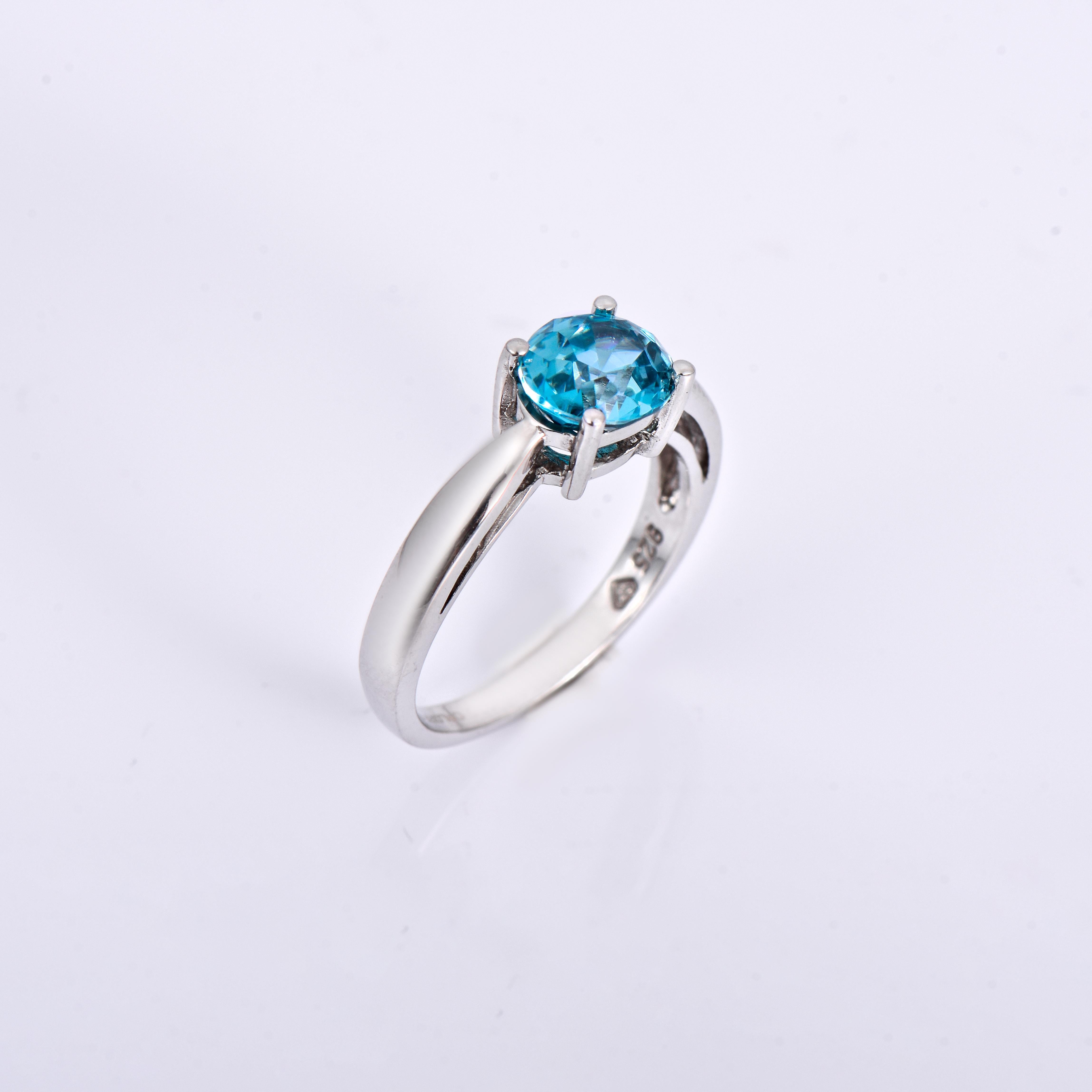 Orloff of Denmark; 925 Sterling Silver Ring set with a 3 carat Natural Cambodian Blue Zircon.

This piece has been meticulously hand-crafted out of 925 sterling silver.
In the center, set with 4 prongs, is a stunning 3 carat blue zircon mined,