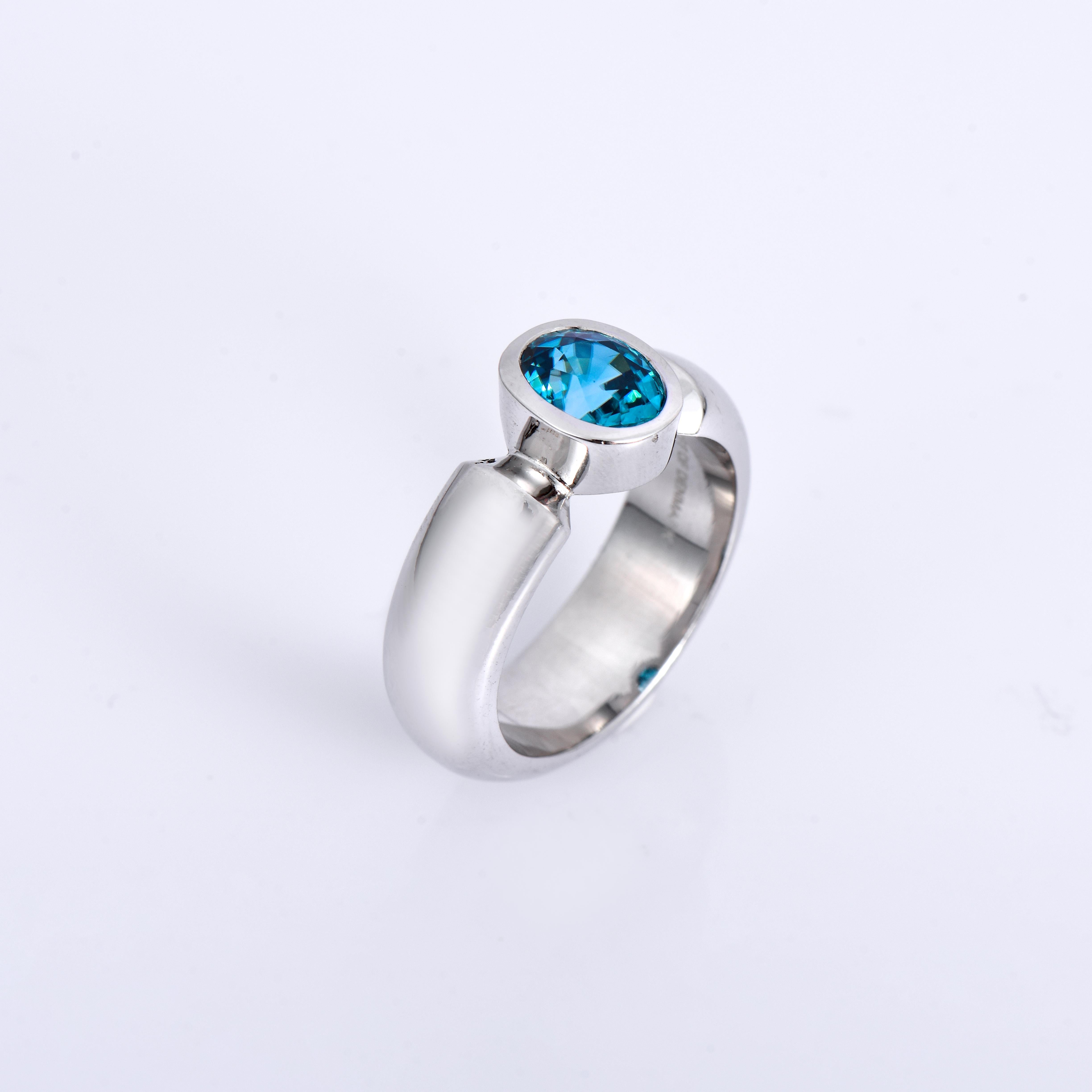 Orloff of Denmark; 925 Sterling Silver Ring set with a 2.38 carat Natural Cambodian Blue Zircon.

This piece has been meticulously hand-crafted out of 925 sterling silver.
At the center lies a vibrant Cambodian blue zircon, its strong blue color