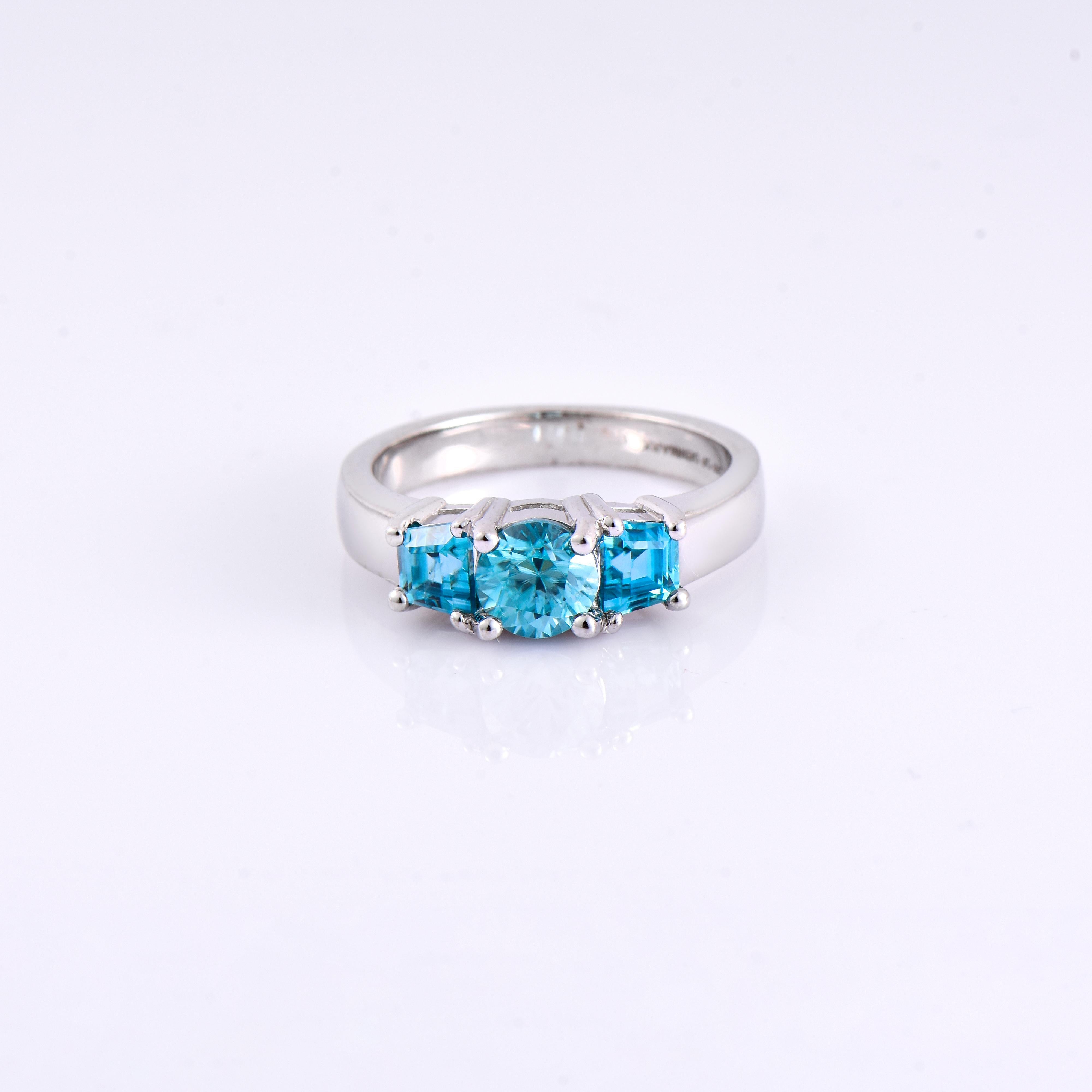 Orloff of Denmark; 925 Sterling Silver Ring set with three Natural Cambodian Blue Zircons totaling to 2.65 carats.

This piece has been meticulously hand-crafted out of 925 sterling silver.
In the center sits a fantastic 1.32 carat blue zircon