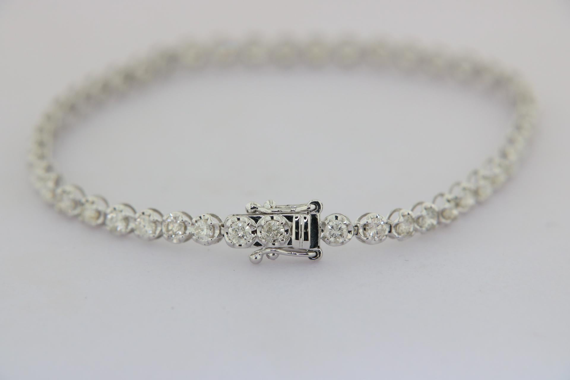 Orloff of Denmark,
This stunning diamond tennis bracelet is exquisitely crafted in 18 karat white gold, offering a luxurious and timeless accessory. It features a total of 46 brilliantly cut diamonds, totaling to 3 carats, each set in a secure