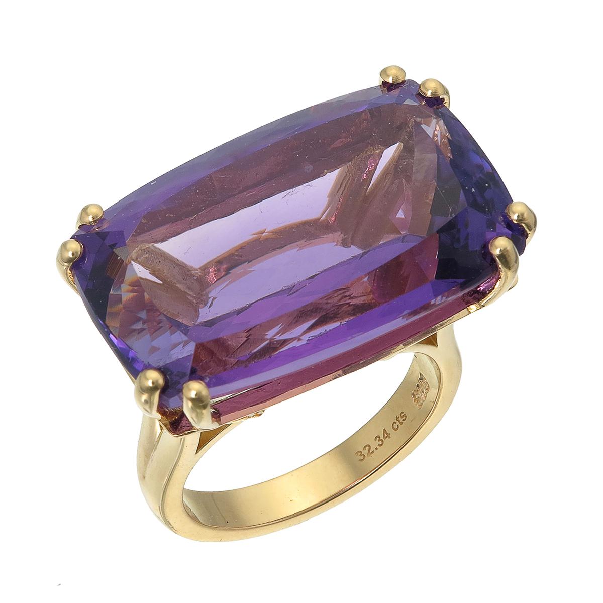 Orloff of Denmark; 18 Karat Gold-Plated Sterling Silver Amethyst Cocktail Ring.

Introducing a striking statement ring crafted in 925 silver and later plated in stunning 18 Karat gold. 
Rising from the center is a captivating 32 carat Amethyst hold