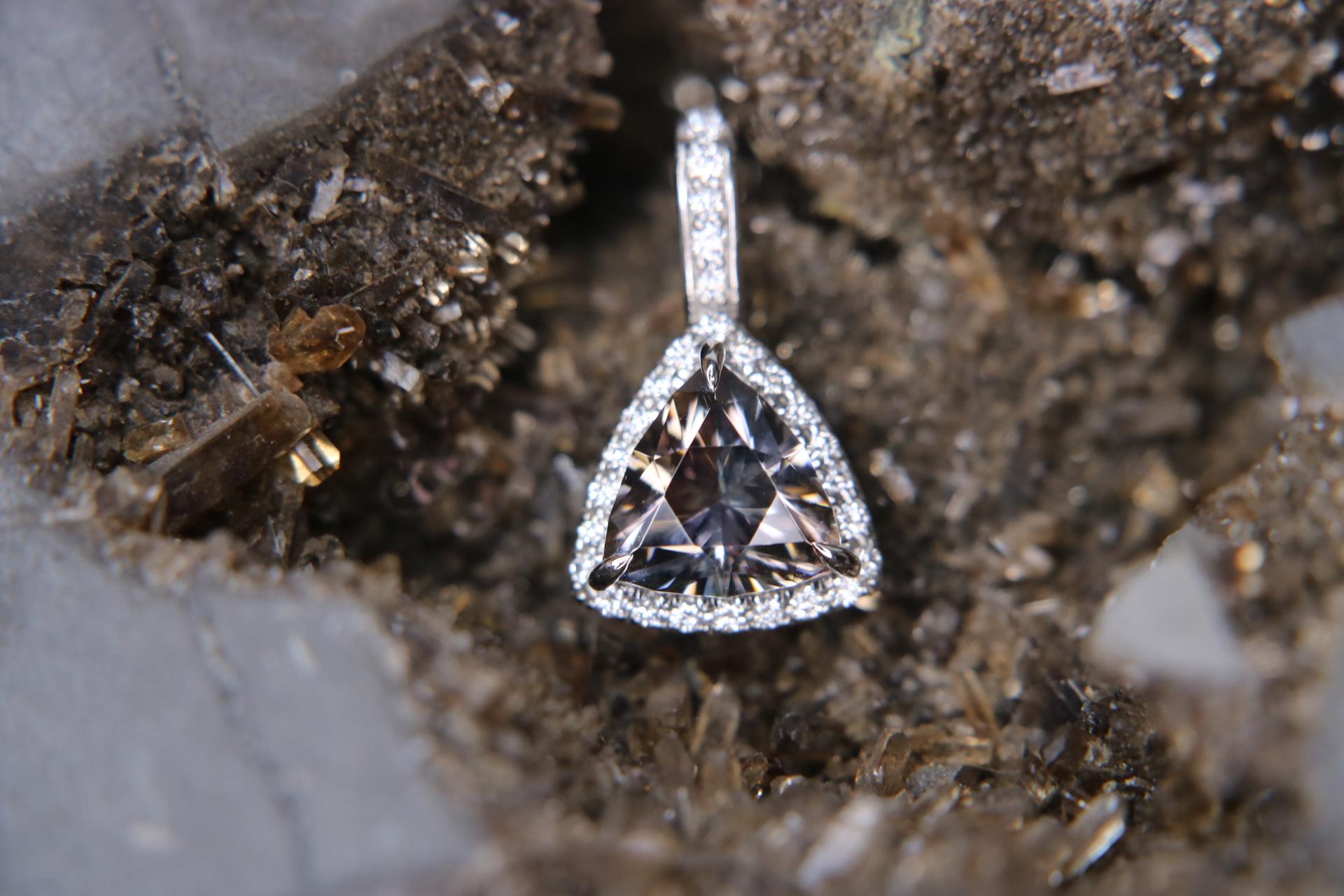 Orloff of Denmark's; 
Twilight Trilliant.

This pendant is an epitome of refined elegance and captivating allure. 
At its heart lies a mesmerizing trillion-cut tanzanite. 
This magnificent gemstone is brilliantly cut into a perfect triangle,