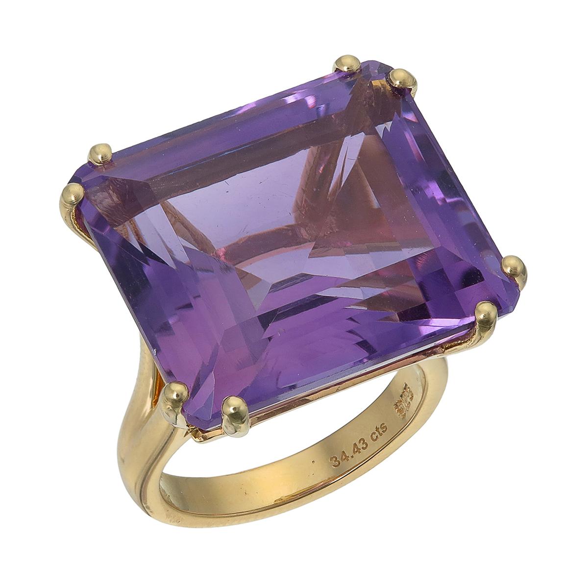 Orloff of Denmark; 18 Karat Gold-Plated Sterling Silver Amethyst Cocktail Ring.

Introducing a striking statement ring crafted in 925 silver and later plated in stunning 18 Karat gold. 
Rising from the center is a captivating 34 carat Amethyst hold