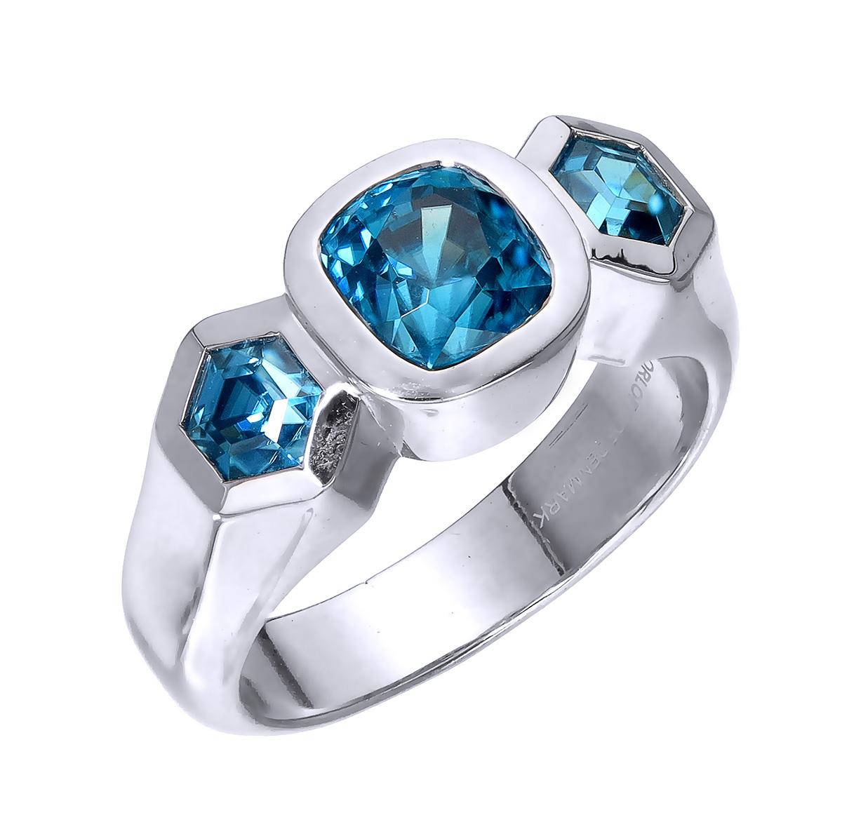 Orloff of Denmark; 925 Sterling Silver Ring set with three Natural Cambodian Blue Zircons totaling to 4.07 carats.

This piece has been meticulously hand-crafted out of 925 sterling silver.
In the center sits a 2.65 carat blue zircon mined, polished