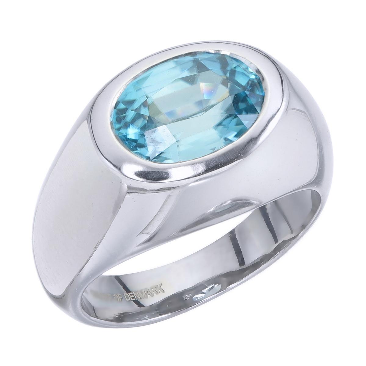 Orloff of Denmark; 4.52 carat Metallic Blue Zircon set in a Solitaire 925 Sterling Silver Ring.

Featured on this peace is a natural blue zircon mined in Ratanakiri, Cambodia and later re-cut in Bangkok, Thailand.
The unique blue of the zircon