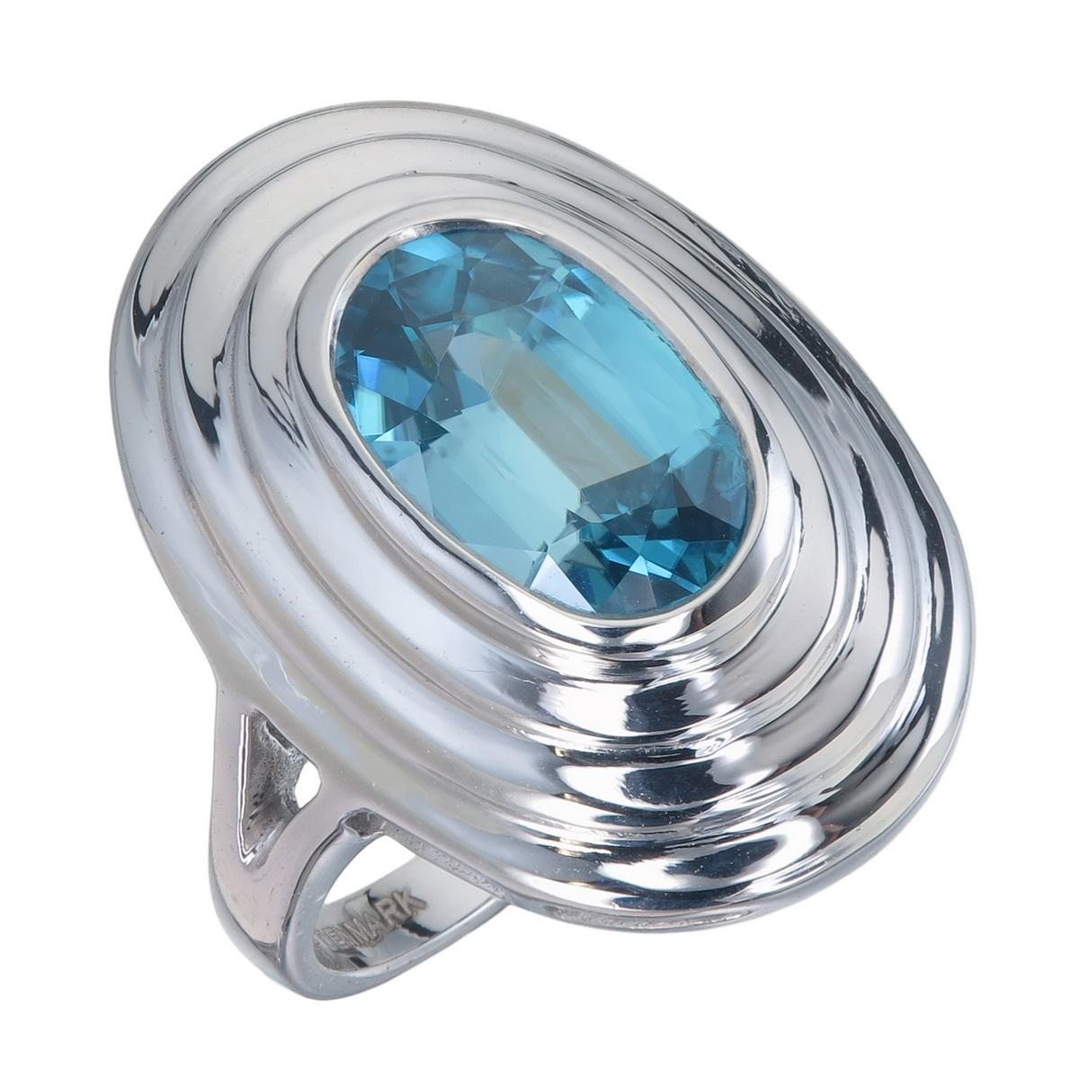 Orloff of Denmark; 4.68 carat Metallic Blue Zircon set in a Triple-Bezel 925 Sterling Silver Ring.

Featured on this peace is a natural blue zircon mined in Ratanakiri, Cambodia and later re-cut in Bangkok, Thailand.
The unique blue of the zircon