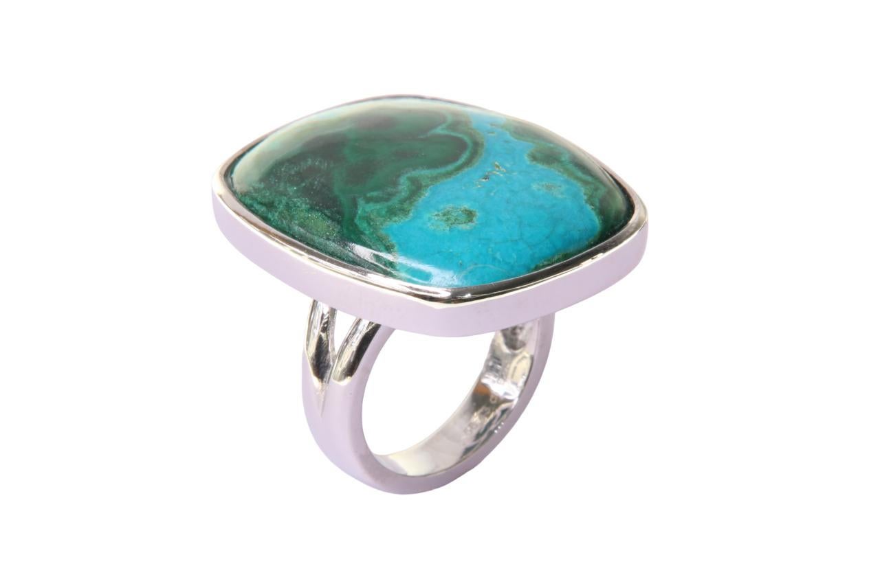 Orloff of Denmark; 56.5 carat Azurite-Malachite Sculpture ring fashioned out of 925 Sterling Silver.

This striking ring is made of 925 sterling silver, featuring a beautifully set azurite-malachite gemstone. The gemstone is notable for its vibrant
