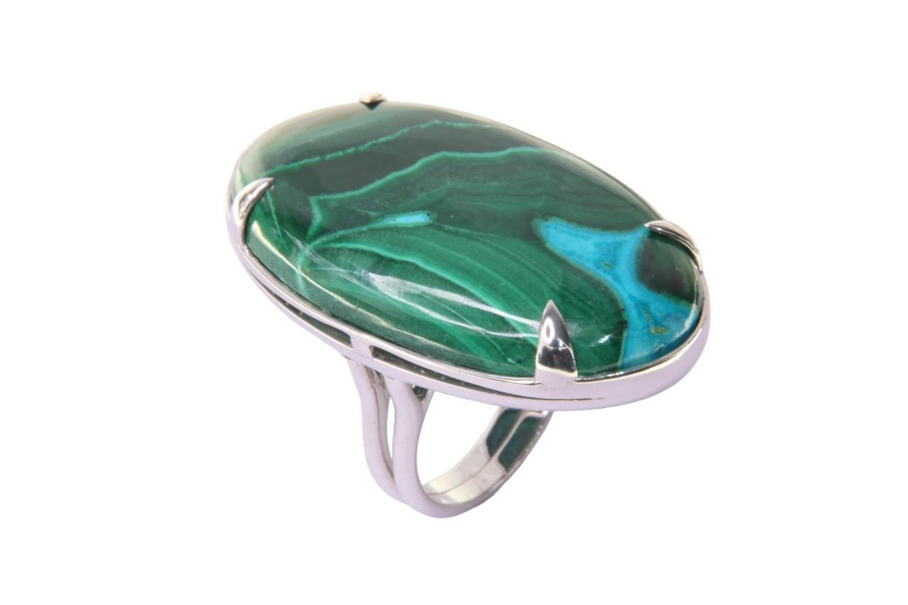 Orloff of Denmark; 67 carat Azurite-Malachite Sculpture ring fashioned out of 925 Sterling Silver.

Behold the elegance of our finely crafted azurite-malachite ring, set in the highest quality 925 sterling silver. This exquisite piece presents a