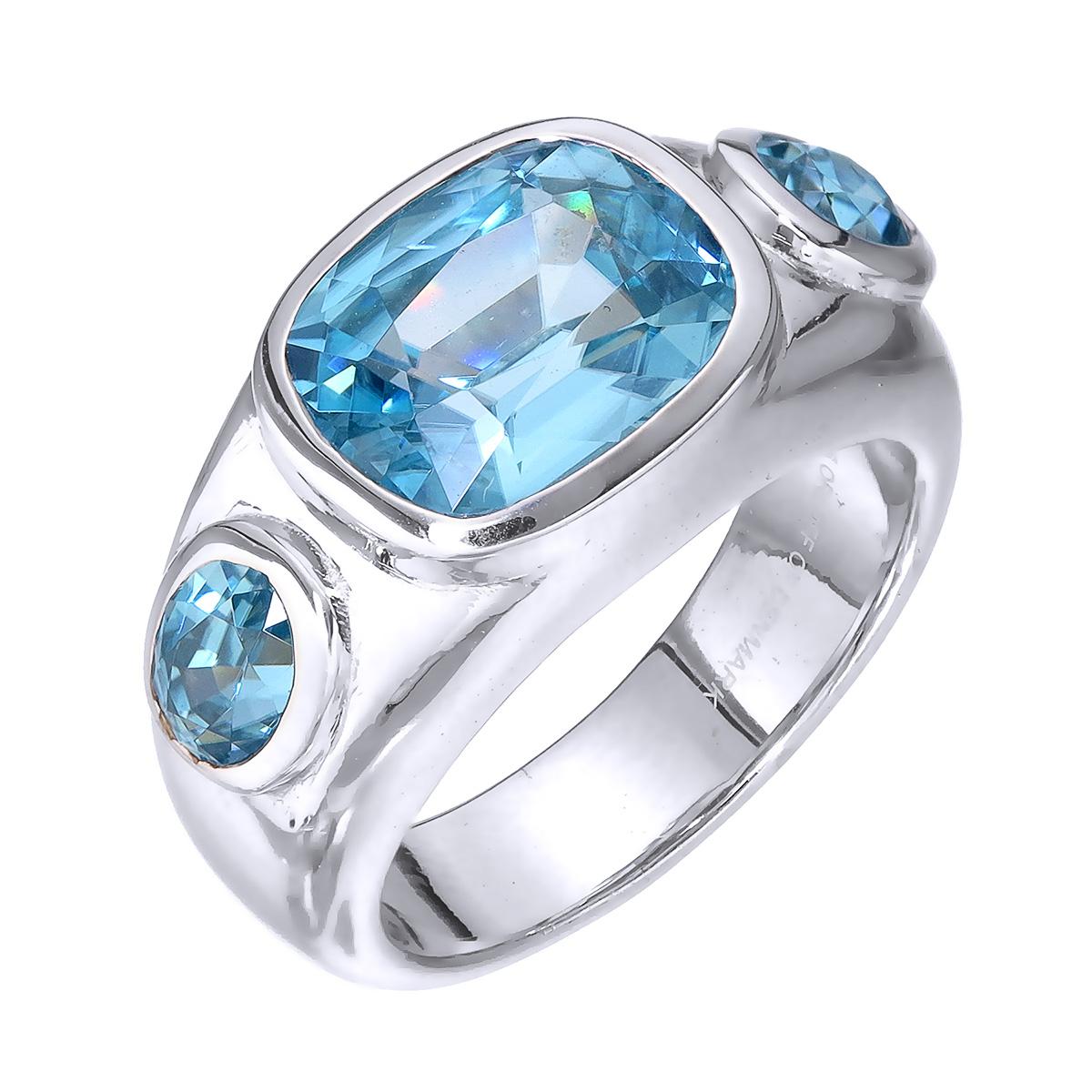 Orloff of Denmark; 925 Sterling Silver Ring set with three Natural Cambodian Blue Zircons totaling to 7.42 carats.

This piece has been meticulously hand-crafted out of 925 sterling silver.
In the center sits a 7.42 carat sky blue zircon mined,