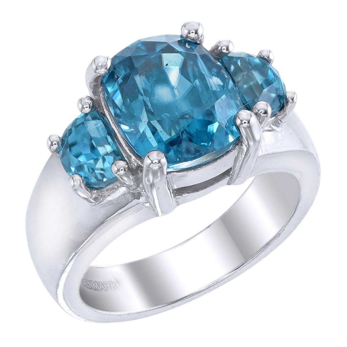Orloff of Denmark; Natural Ocean Blue Zircon, Three-Stone ring set in 925 Sterling Silver.

Featured on this piece are three natural, ocean blue zircons mined, polished and cut in Ratanakiri, Cambodia.
Held securely by four button-prongs, these