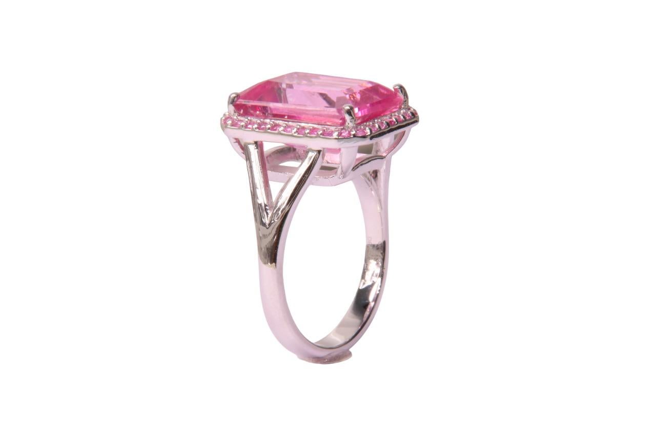 Orloff of Denmark; Pink Topaz and Sapphire Ring fashioned out of 925 Sterling Silver.

This alluring ring is centered around a 9-carat pink topaz, cut in a bold emerald style that highlights its striking clarity and vibrant pink hue. The topaz is