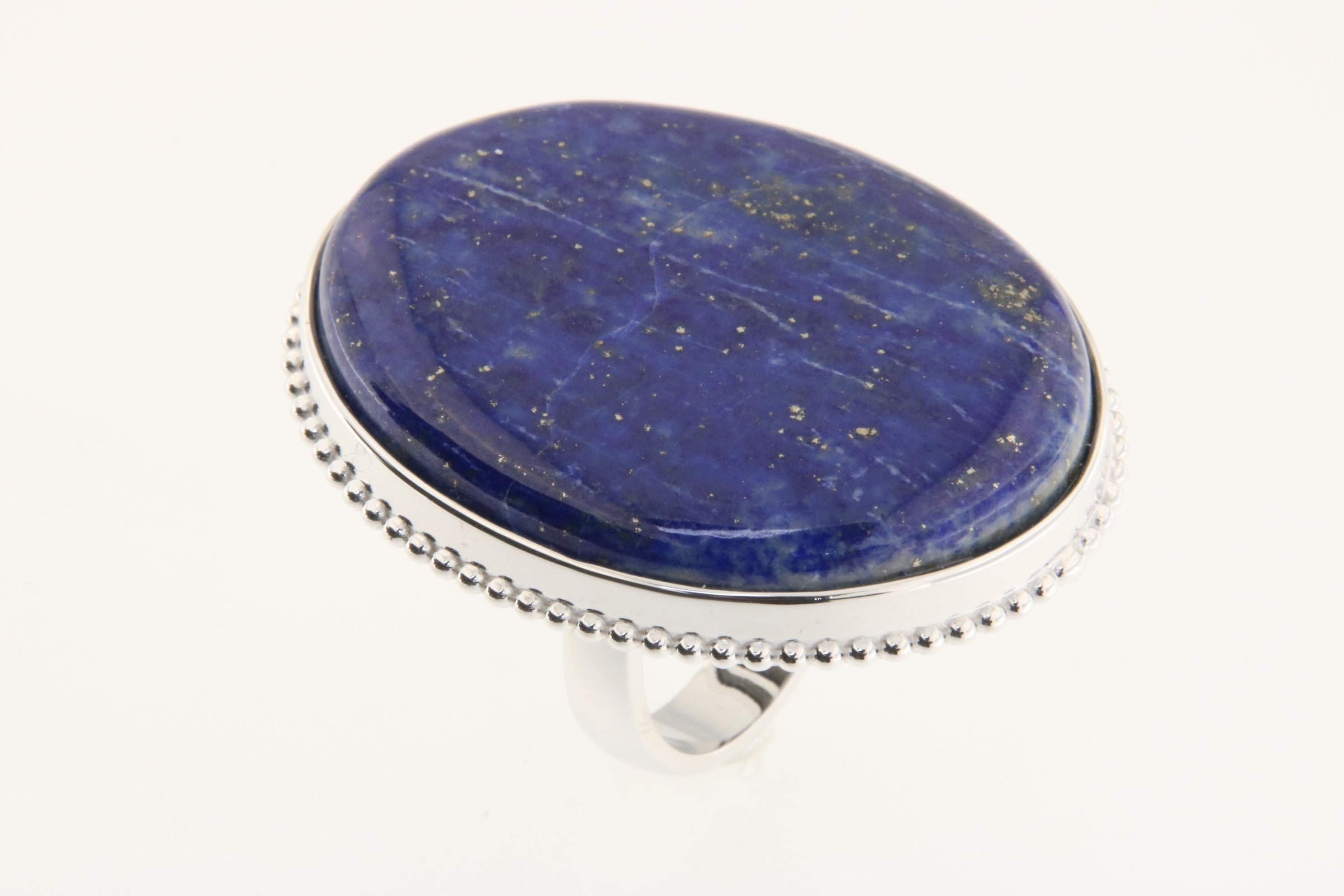 Orloff of Denmark; 73.13 carat Lapis Lazuli Ring fashioned out of 925 Sterling Silver.

This beautiful ring features a 73-carat Lapis Lazuli gemstone, prized for its deep celestial blue punctuated by natural golden flecks of pyrite. The gemstone is