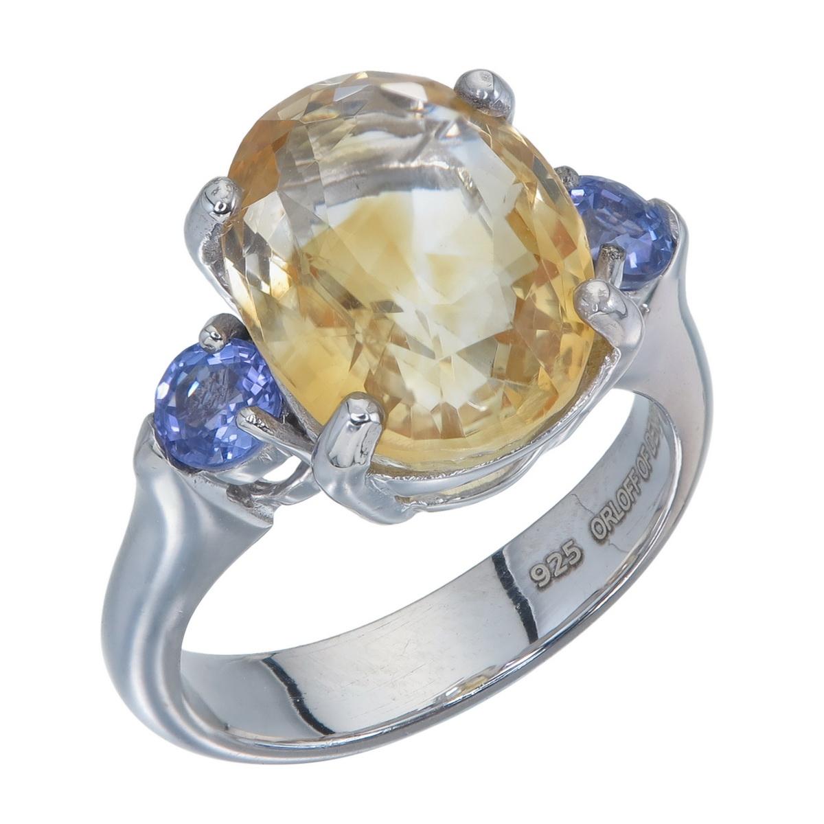 Orloff of Denmark; Large Citrine set with two beautiful blue Tanzanites.

Large yellow Citrine Quartz contrasted wonderfully with two blue & violet Tanzanites set in a 925 Sterling Silver Band.

Tanzanite also know as 'Blue Zoisite' is a stunning