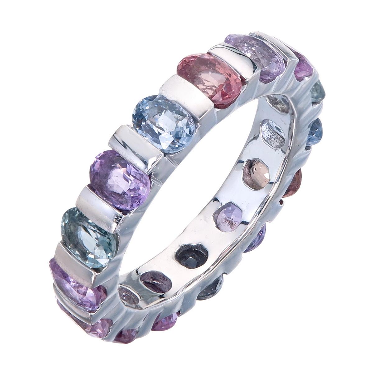 Orloff of Denmark; Fifteen Fancy Sapphire Eternity Band set in 925 Sterling Silver.

Ranging from blues to pinks and even light greens, these fancy sapphires come together to form a gorgeous band of eternal color and sparkle.
Elegantly flush-set in