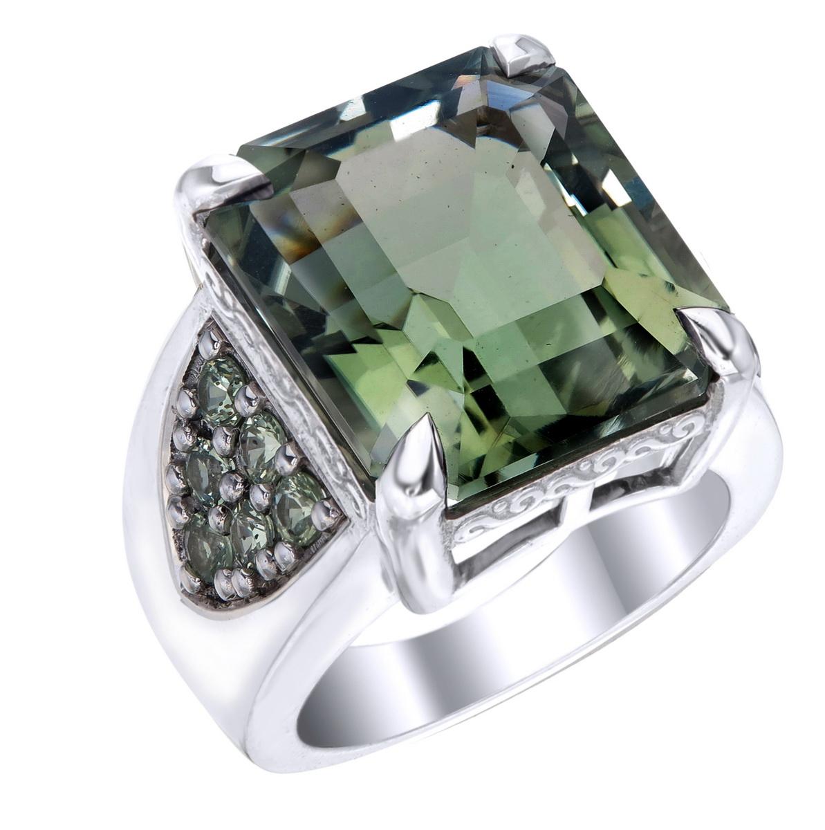 Orloff of Denmark; 17.06 carat Green Amethyst Sterling Silver Ring set with twelve Fancy Green Sapphires.

This piece has been fashioned out of 925 sterling silver, and features a 17 carat green amethyst gem held by a claw setting of four sharp