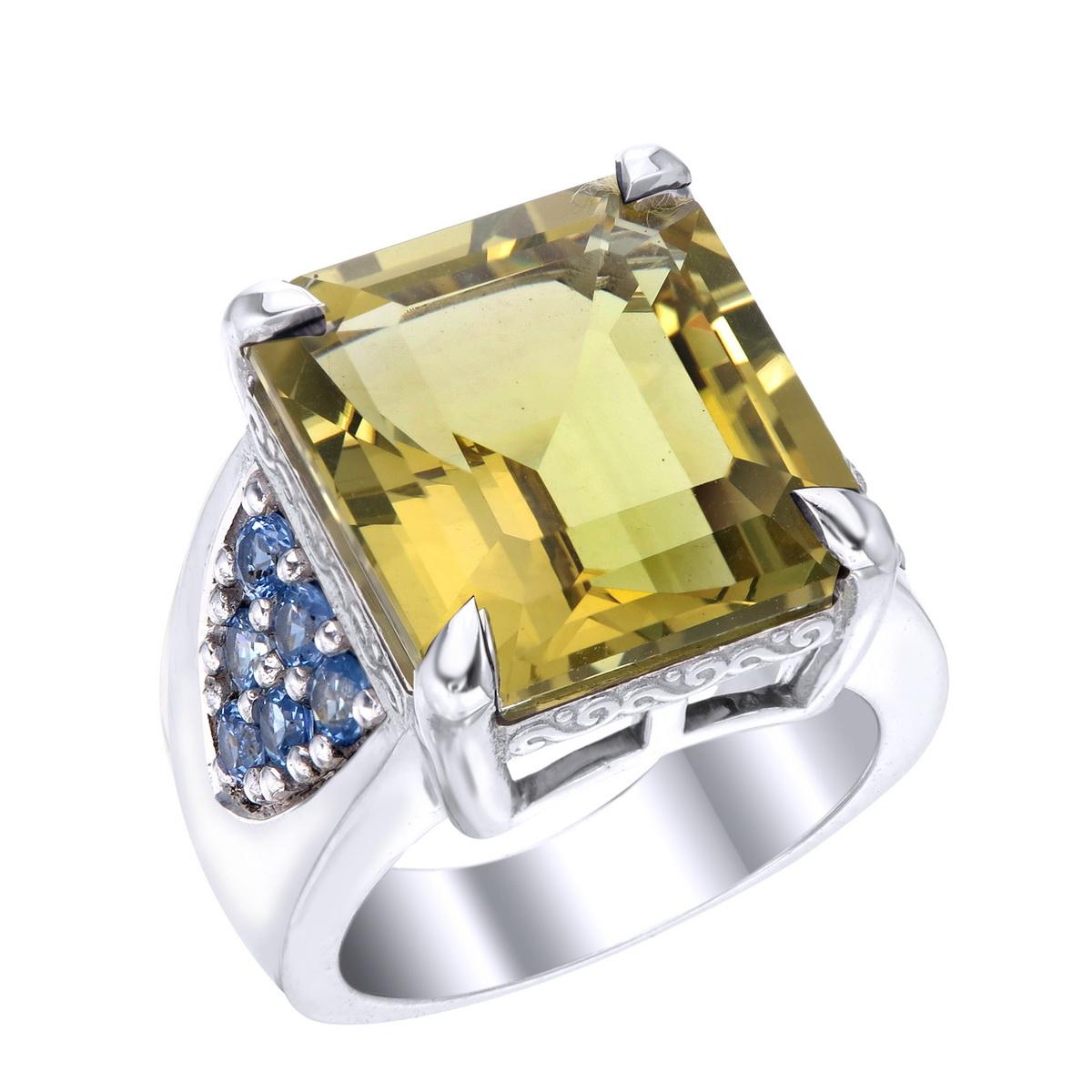 Orloff of Denmark; 15.16 carat Lemon Quartz Sterling Silver Ring set with twelve Blue Sapphires.

This piece has been fashioned out of 925 sterling silver, and features a 15 carat lemon quartz gem held by a claw setting of four sharp prongs.
With