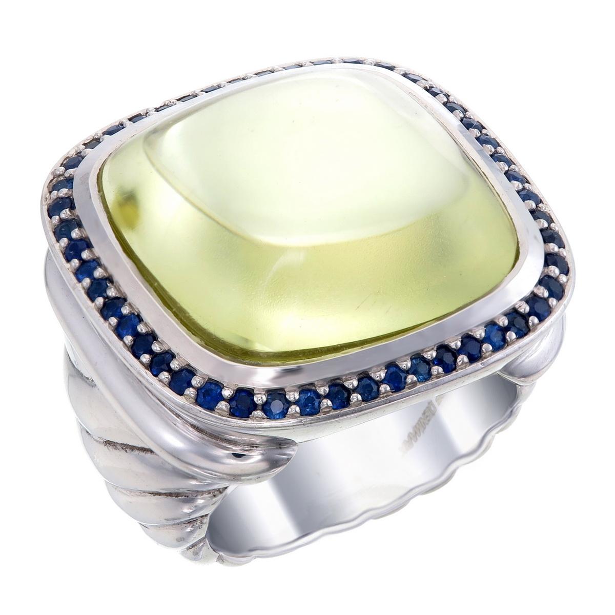 Orloff of Denmark; Sterling Silver Statement Ring set with a huge Lemon Quartz surrounded by a total of 0.50 carats of Blue Sapphires.

Introducing a captivating 925 silver statement ring that's sure to turn heads. 
This ring showcases a wide and