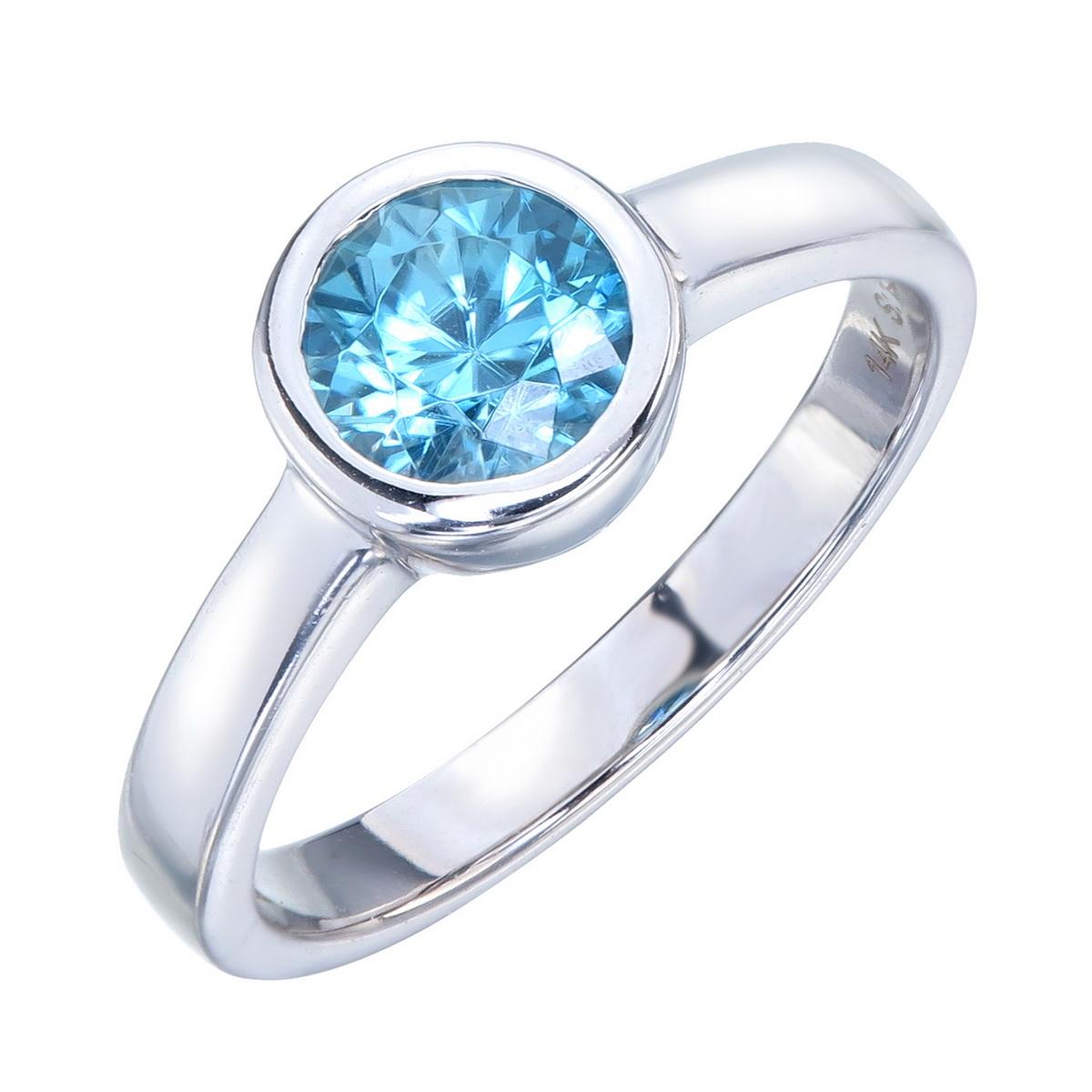 Orloff of Denmark; 14 Karat Solitaire Ring set with a sensational Natural Metallic Blue Zircon from Ratanakiri, Cambodia.
This particular Zircon has been recut from a crudely shaped oval into an excellent brilliant cut round ending up at 1.38