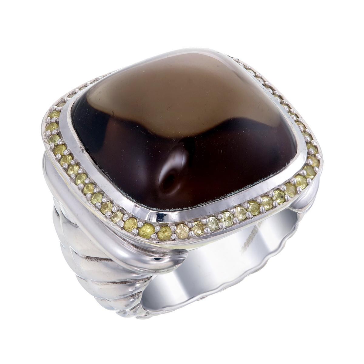 Orloff of Denmark; Sterling Silver Statement Ring set with a huge Smoky Quartz surrounded by a total of 0.50 carats of Yellow Sapphires.

Introducing a striking 925 silver statement ring that effortlessly captures attention. 
This ring boasts a