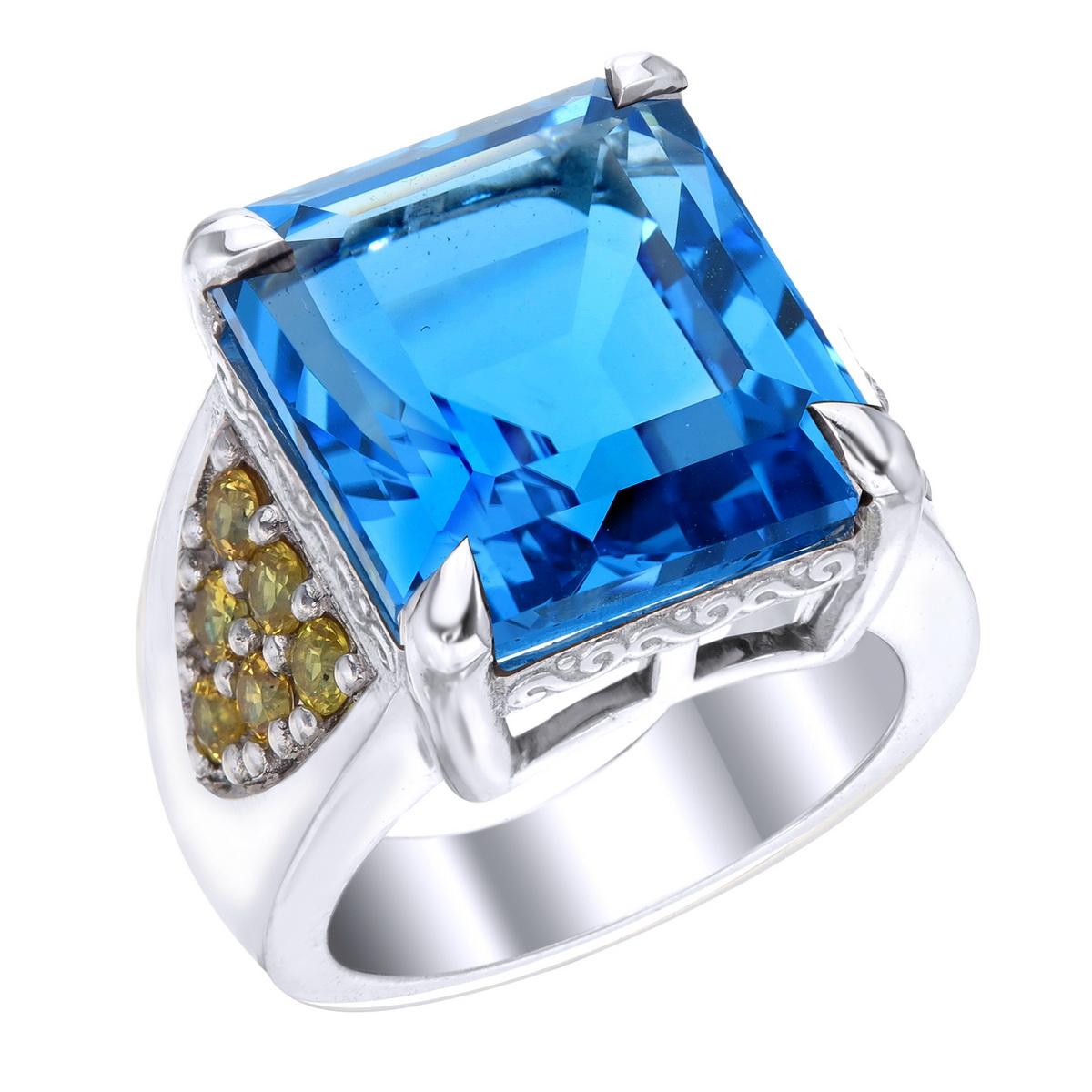 Orloff of Denmark; 24.4 carat Swiss Blue Topaz Sterling Silver Ring set with twelve Fancy Yellow Sapphires.

This piece has been fashioned out of 925 sterling silver, and features a 24 carat Swiss blue topaz held by a claw setting of four sharp