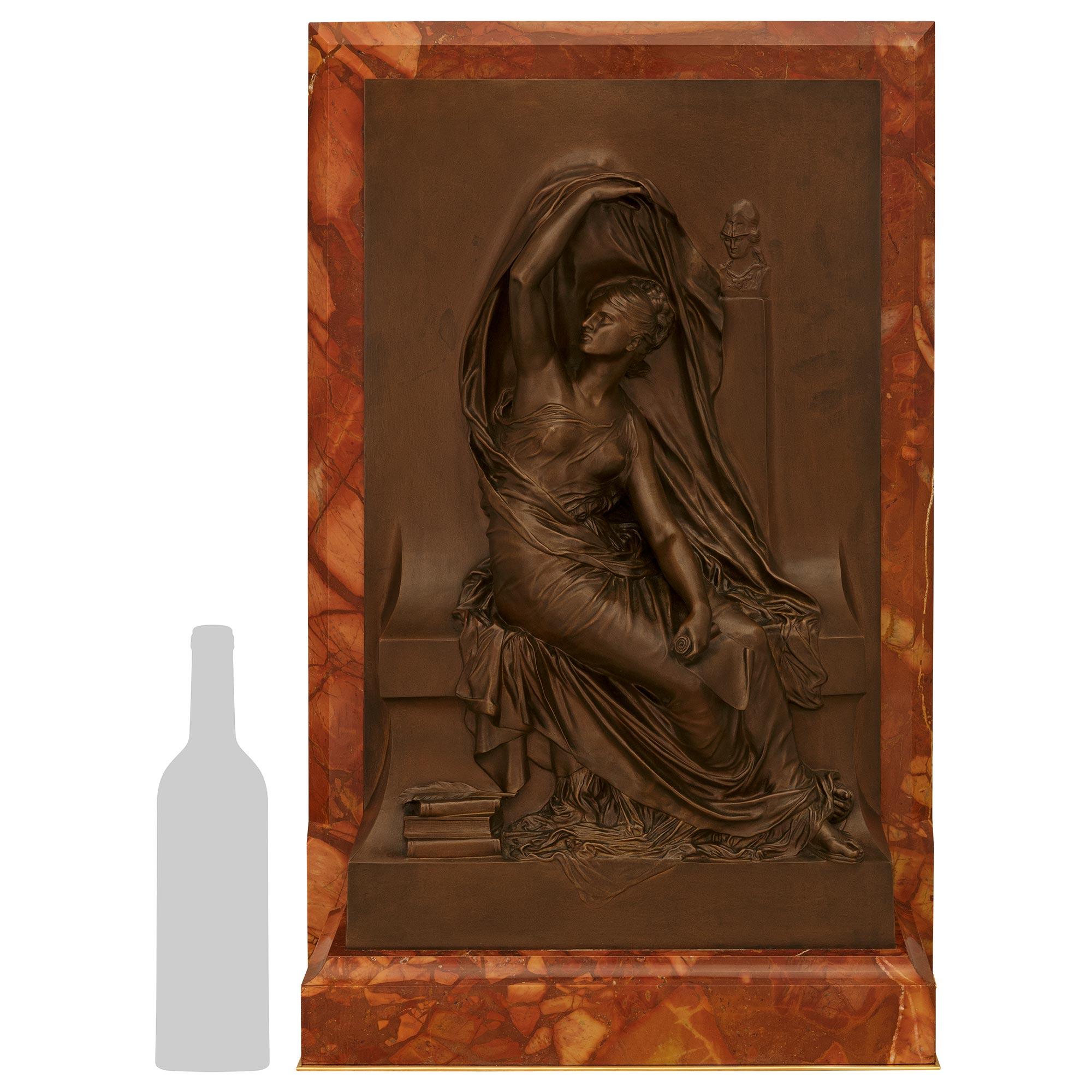 A handsome French 19th century patinated Bronze, Ormolu and Breccia Pernice marble trophy of Clio, singed by Henri Chapu. The stunning commemorative trophy is raised by an Ormolu bottom plate below the solid Breccia Pernice marble body. Above is the