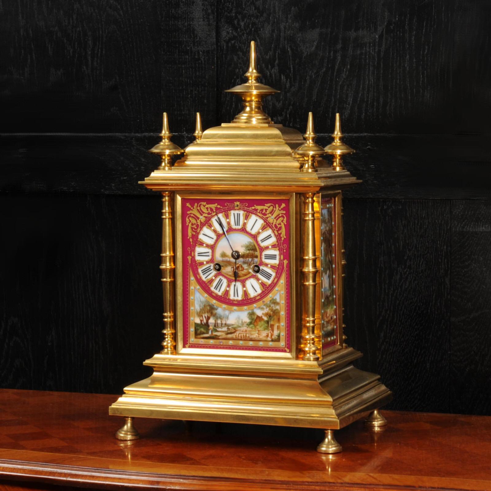 A magnificent ormolu (finely gilded bronze) and Sèvres style porcelain clock by renown maker Achille Brocot. It is of a beautifully chic design, four turned corner columns with a cushion shaped top with 5 finials. The front and sides are mounted