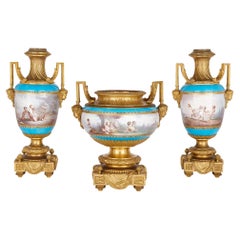 Ormolu and Sèvres-style porcelain three-piece garniture suite