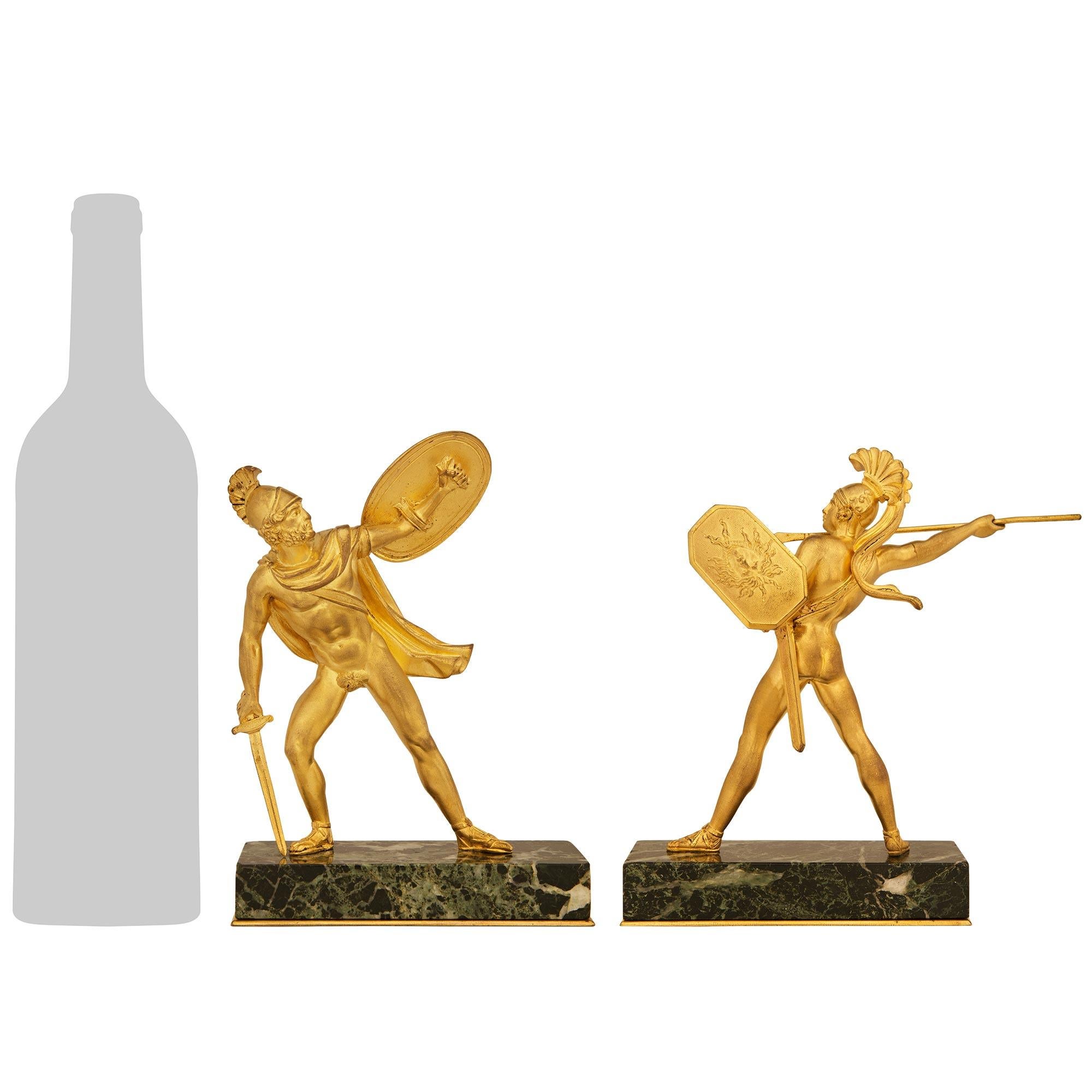 A striking and high quality true pair of French 19th century Ormolu and Verde Antico marble statues of The Intervention of the Sabines. Each handsome statue is raised on its original rectangular Verde Antico marble plinth above an Ormolu base plate.