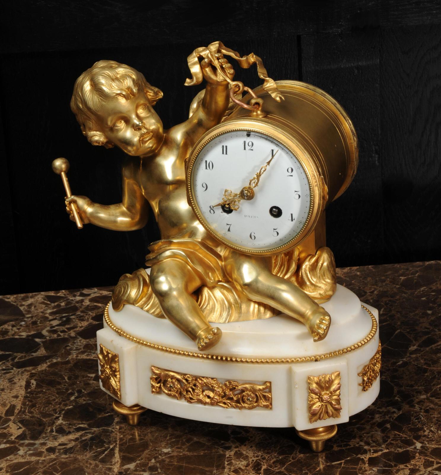 Rococo Ormolu and White Marble Antique Clock, Putto Floating in Clouds Playing a Drum