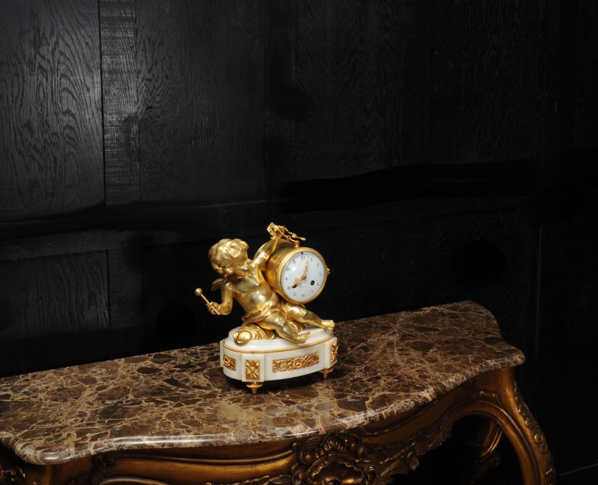 French Ormolu and White Marble Antique Clock, Putto Floating in Clouds Playing a Drum