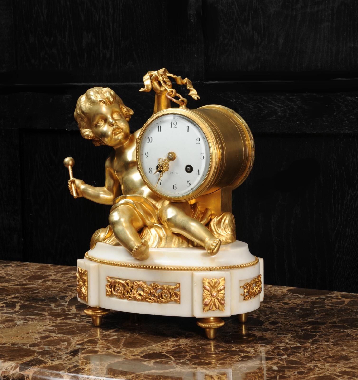 Ormolu and White Marble Antique Clock, Putto Floating in Clouds Playing a Drum 1