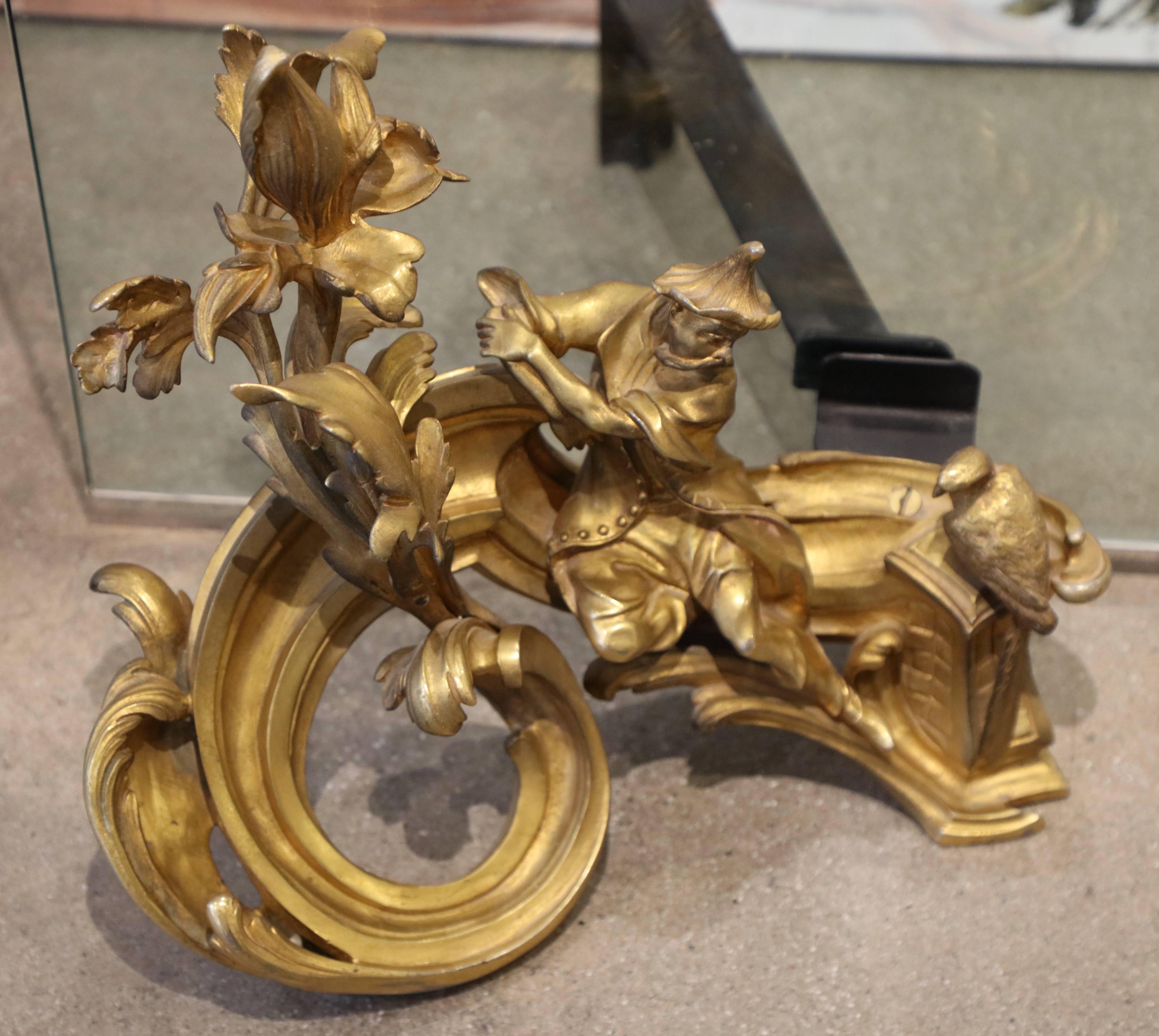 A wonderful re-purposing of 19th century ormolu gilt bronze chenets. Someone added supports for a glass fire screen. These chants are of exceptional quality and are stamped E*M. Not sure of the foundry, but these are of extremely high quality. The
