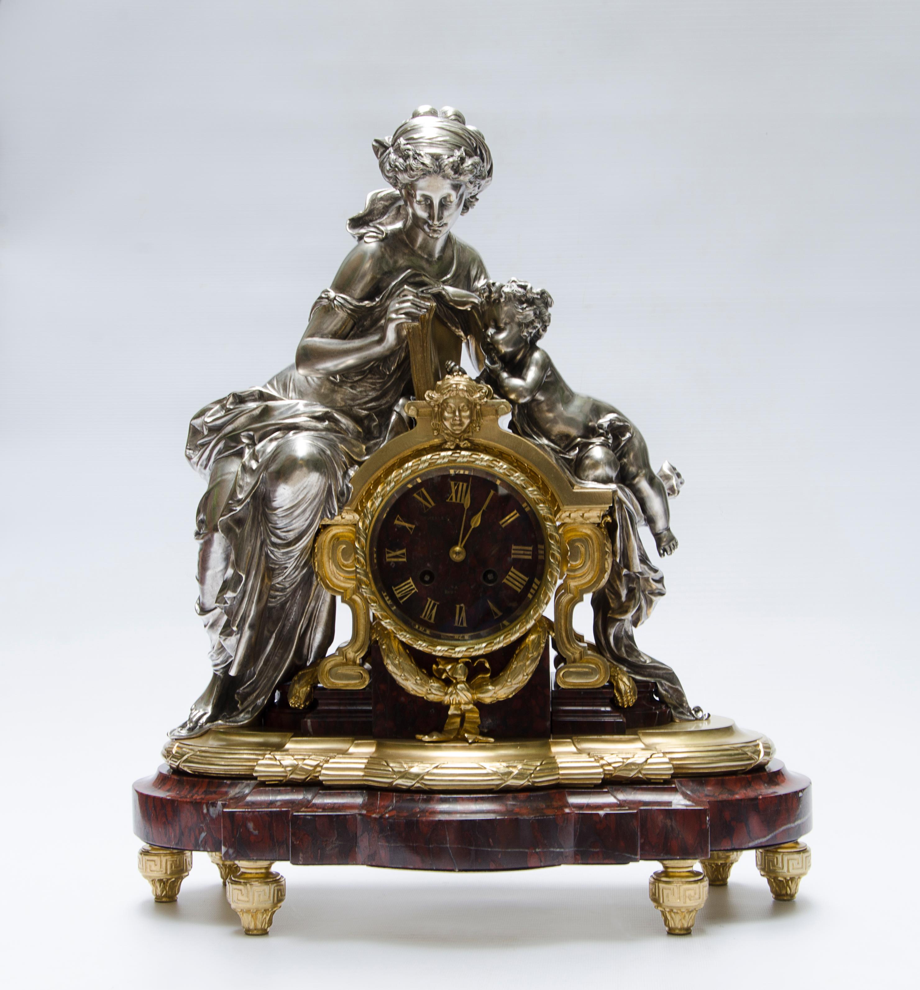 Late 19th century french Louis XVI ormolu gilt bronze mantel clock by Lamerie-Charpentier & Cie.

By: Lemerle-Charpentier & Cie.
Material: bronze, glass, marble, metal, ormolu
Technique: cast, gilt, metalwork, molded, polished
Dimensions: 8 in x 17