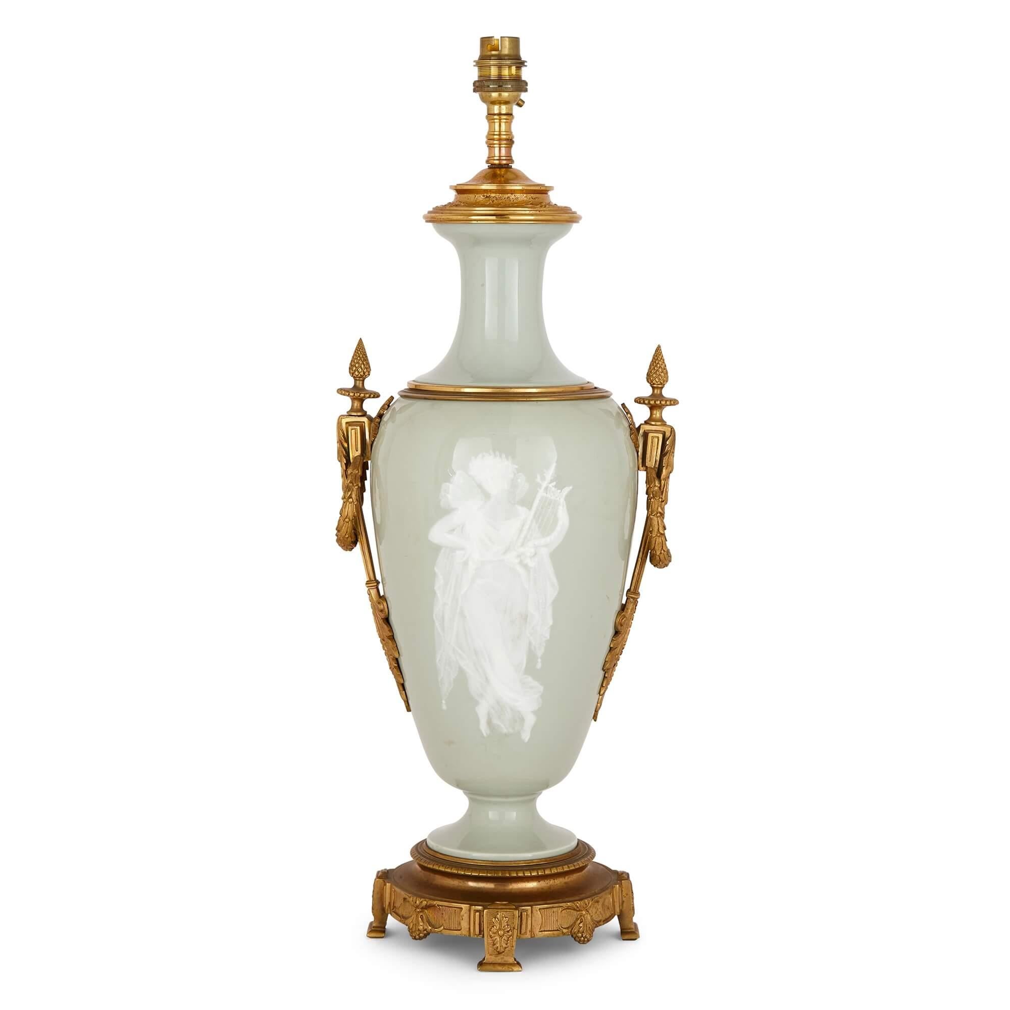 Ormolu mounted Celadon Porcelain Pâte-sur-pâte vase-form lamp
French, late 19th century
Measures: Height 54cm, width 21cm, depth 17cm

Consisting of gilt bronze mounts atop pâte-sur-pâte celadon porcelain, this beautiful lamp base, with a