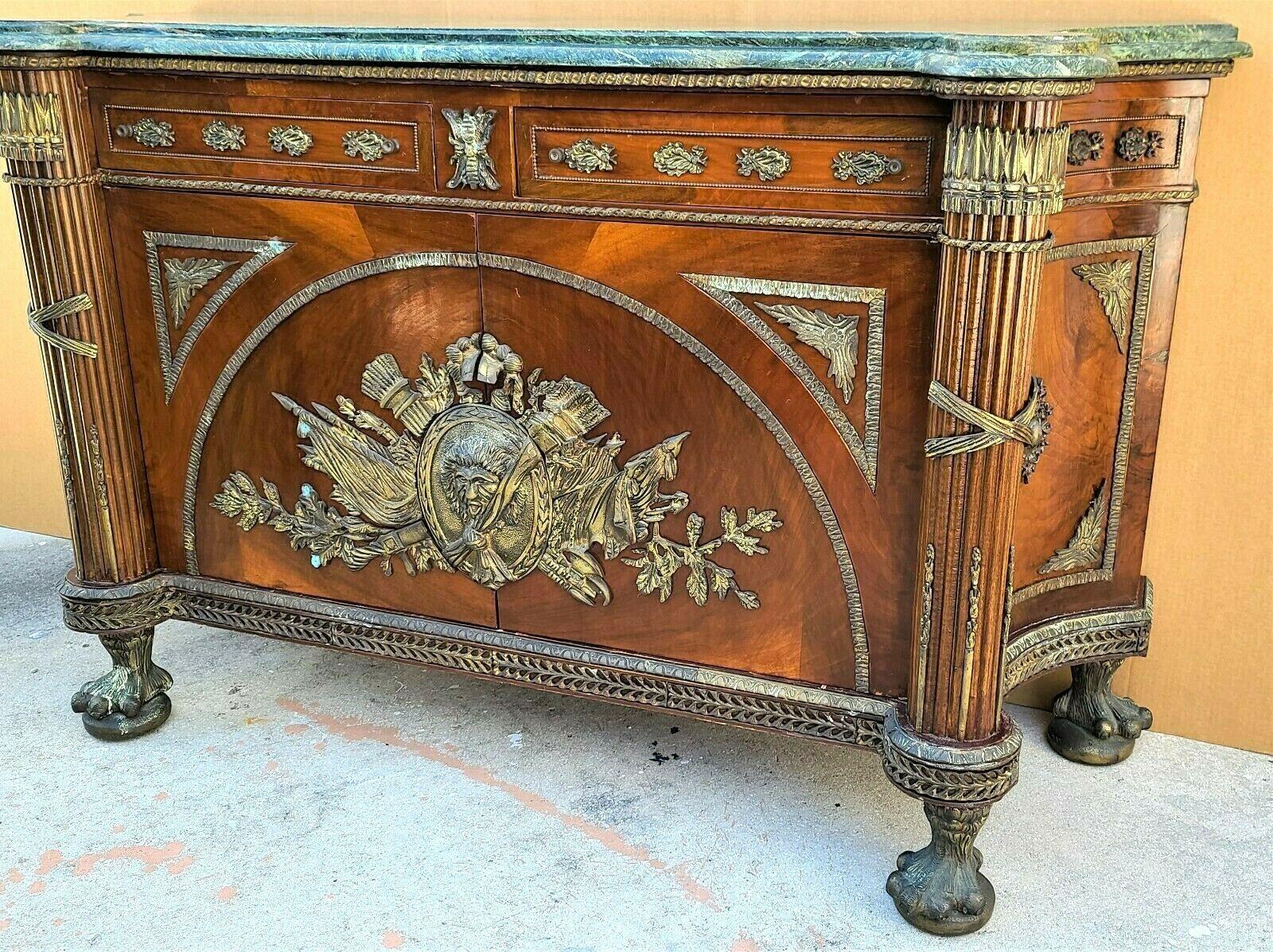 Offering One Of Our Recent Palm Beach Estate Fine Furniture Acquisitions Of A
Spectacular Ormolu Mounted Mahogany French Regency Style Marble Top Buffet Sideboard
Embellished by elaborate Bronze Ormolu trim in Roman Empire motif, a beveled marble