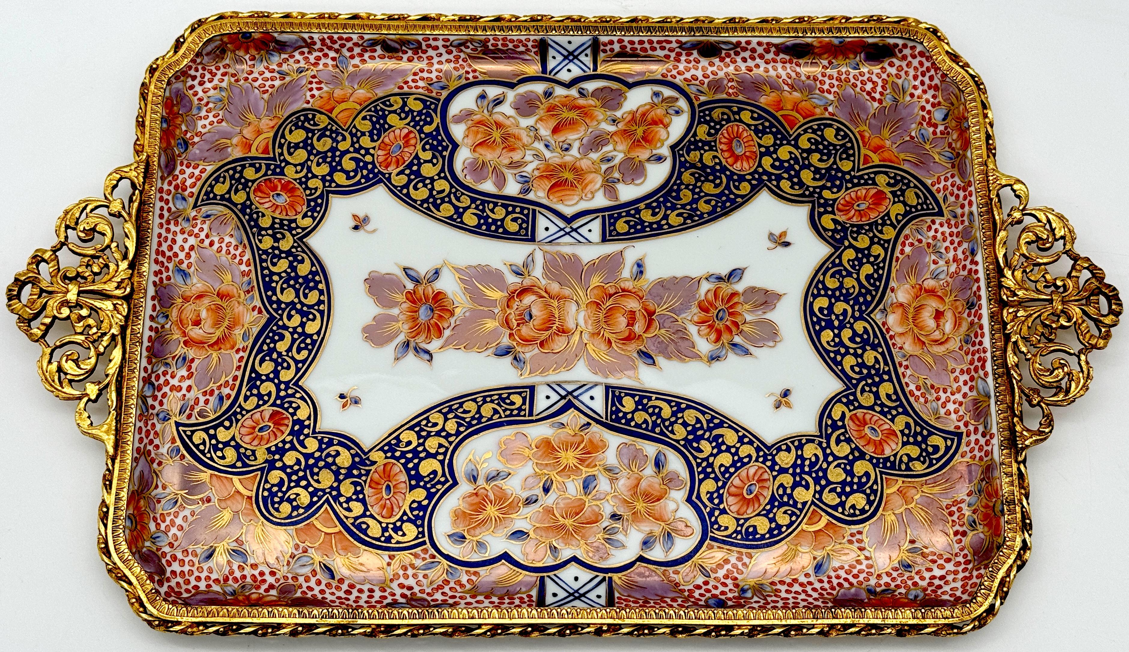 Ormolu Mounted Limoges Royal Crown Derby Style 'Imari' Handled Tray 
France, circa 1900s

An exquisite Ormolu Mounted Limoges Tray in the Royal Crown Derby Style 'Imari' pattern, hand-painted in Limoges, France. This stunning example boasts a finely