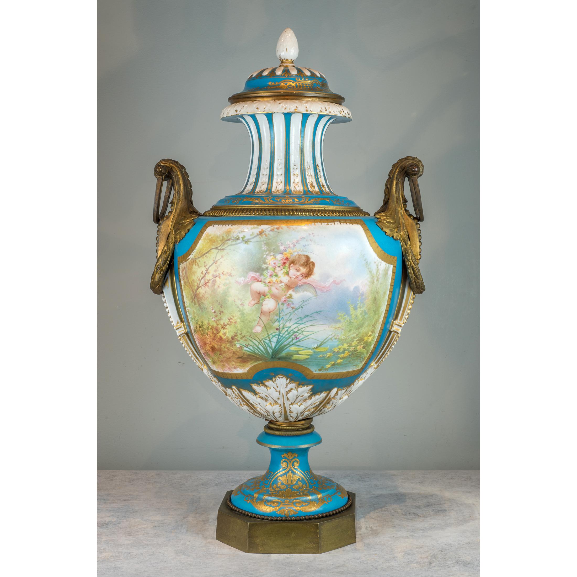 A fine ormolu-mounted Sèvres style turquoise-ground vase and cover


The finely painted spurious blue interlaced signed ‘A Collot’ with a seated maiden emblematic of spring attended by two putti, the reverse with a putto holding an emblem of his