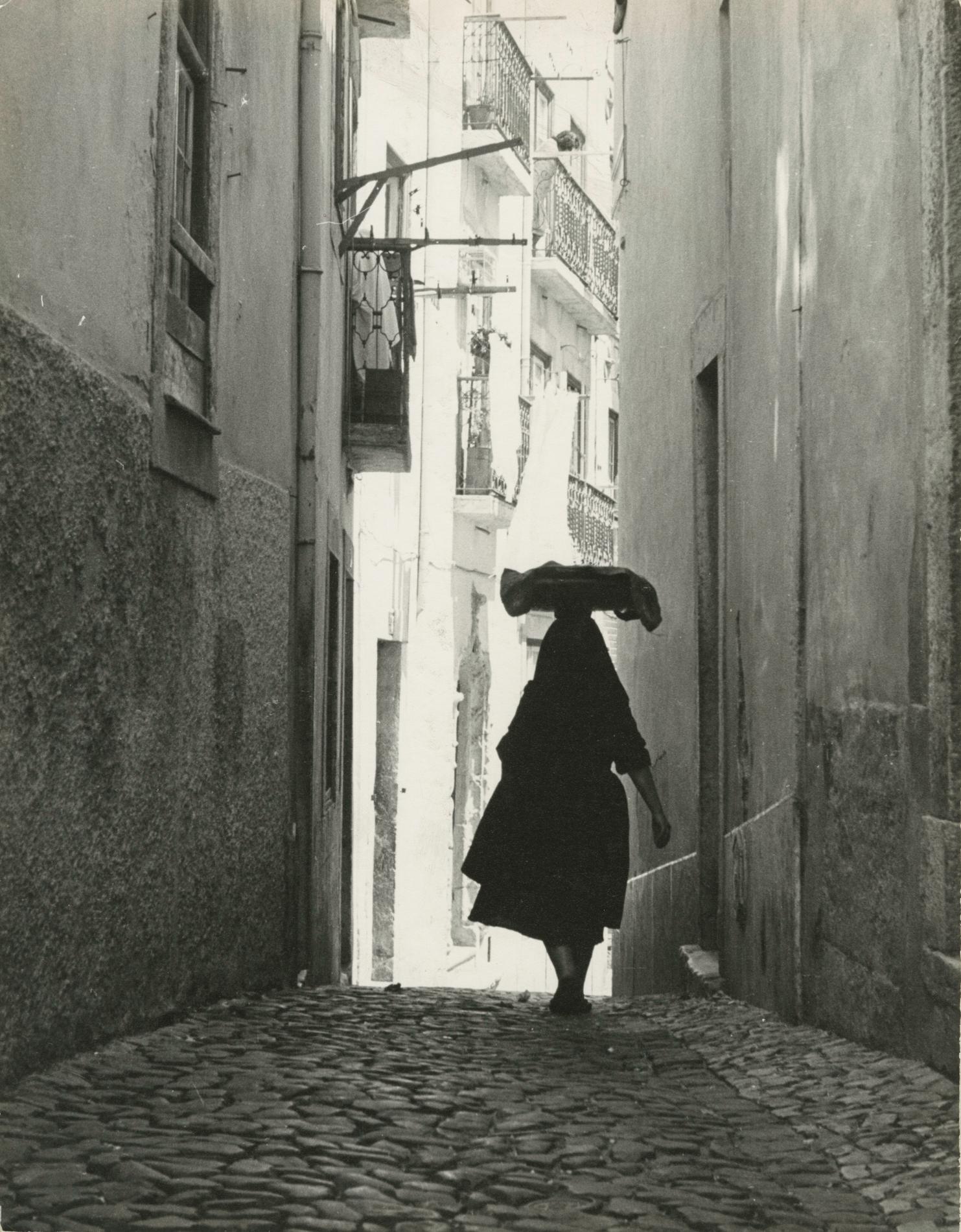 Ormond Gigli Figurative Photograph - Woman in the Alley, Portugal