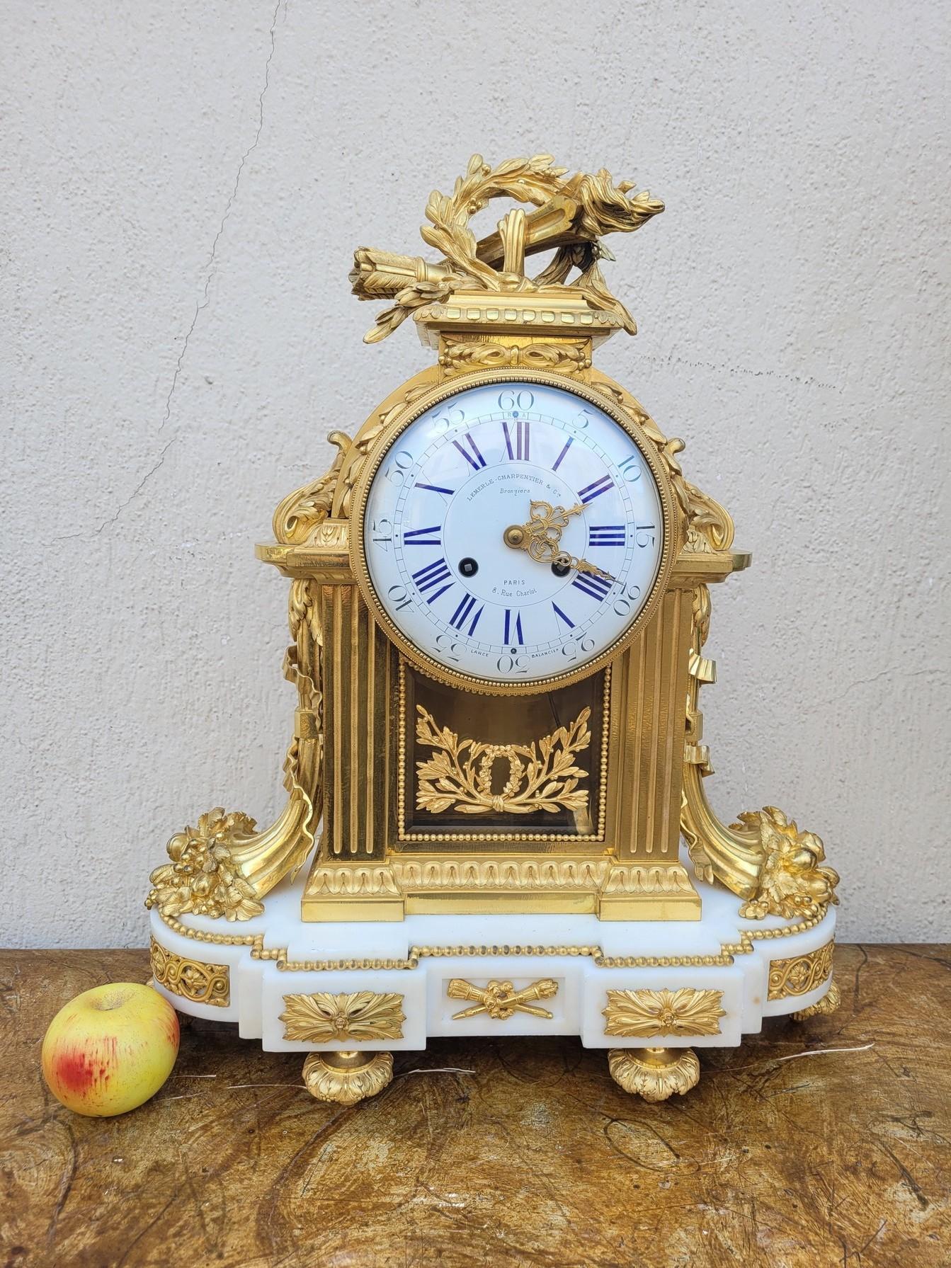 French Ormulu Clock with white Marble, Charpentier, Louis XVI style, 19th Century For Sale