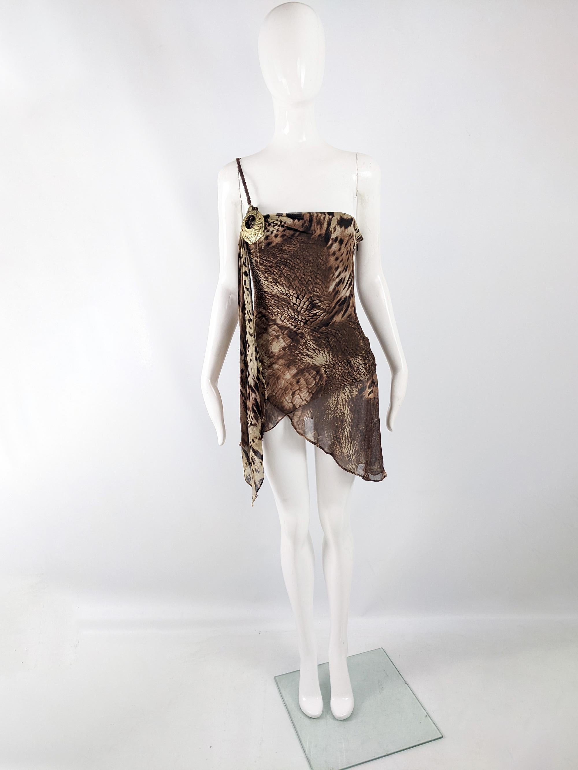 An incredible vintage y2k top from the early 2000s by luxury French designer, Orna Farho of Paris. In a brown floaty, bias cut silk chiffon with animal prints throughout. It has an asymmetrical design with one shoulder and a large clasp detail