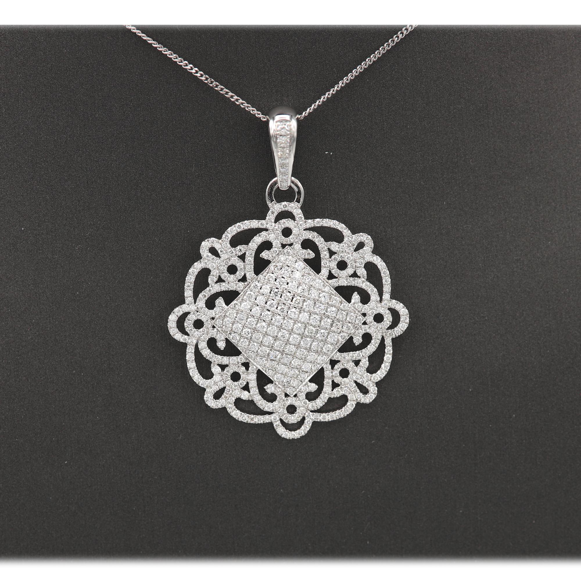 Elegant Diamond Ornament Style Pendant, Full with Diamonds. 18k White Gold 8.60 grams.
Total Diamonds 1.87 carat G-SI. Size: Approx 30 mm or 1.25' Inch. Looks much better in real.
+ Chain 16' Inch