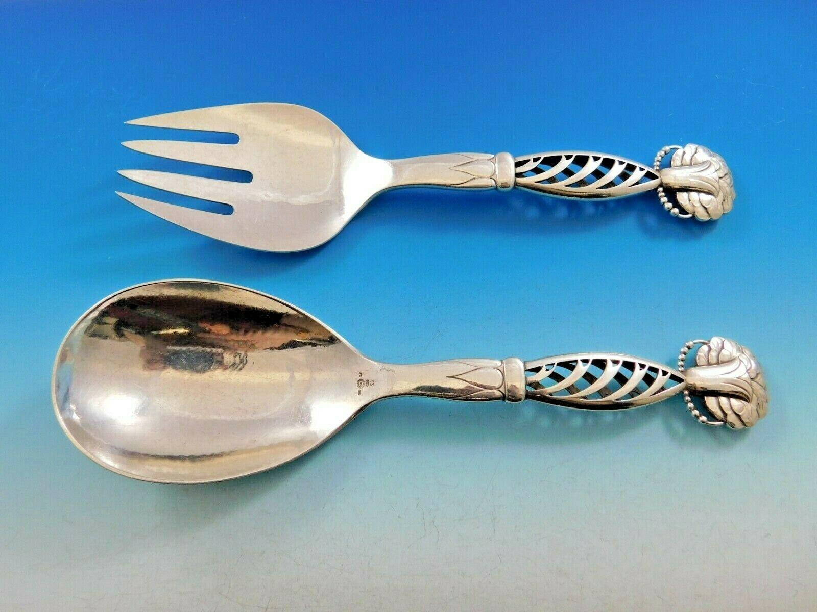 Ornamental #83 by Georg Jensen.

Sterling silver hollow handle salad serving set two-piece 9 1/2