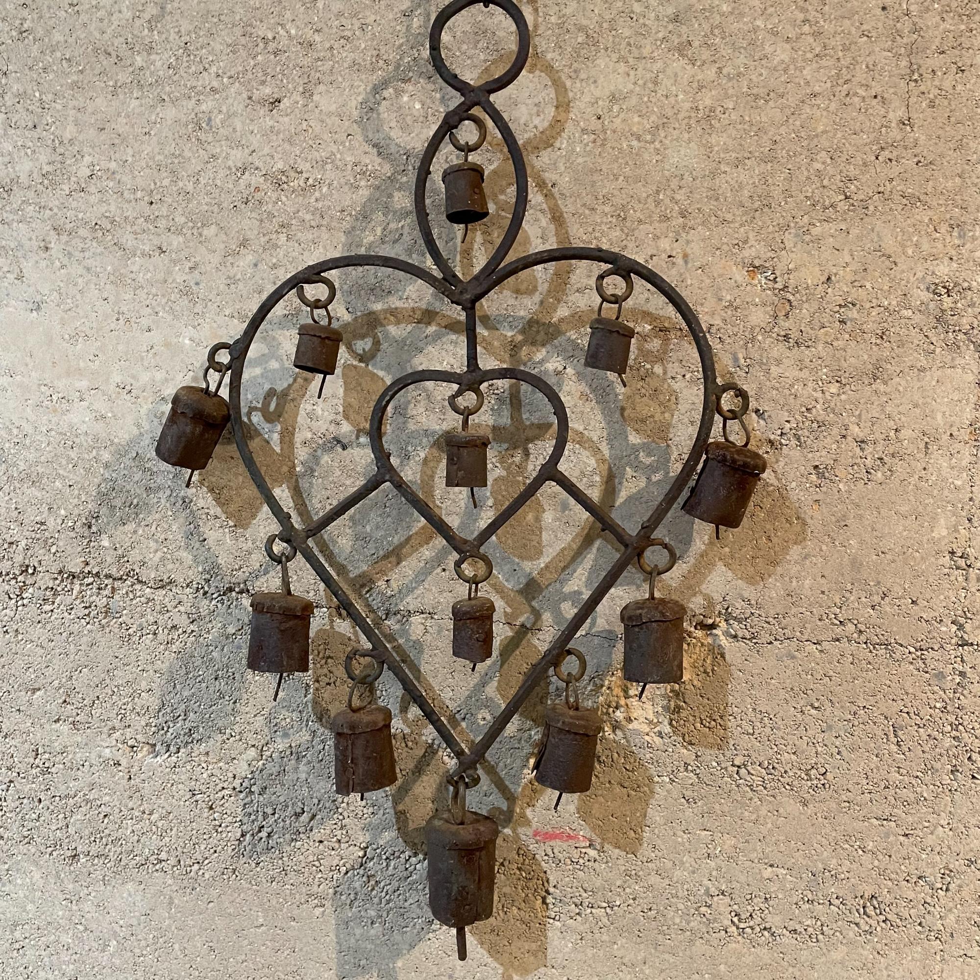 Ornamental Antique Rustic Metal Heart Wall Art Hanging Decor Wall Windchime with Bells from Mexico 1970s
Vintage piece.
Measures:19.5T x 8W x 1.5 inches
Unrestored Vintage Presentation and Condition. Refer to all images.
See dealer for more