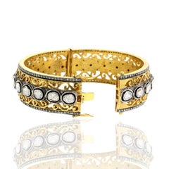 Ornamental Design Bangle with Diamonds Surrounded by Pave Diamond Made in Gold