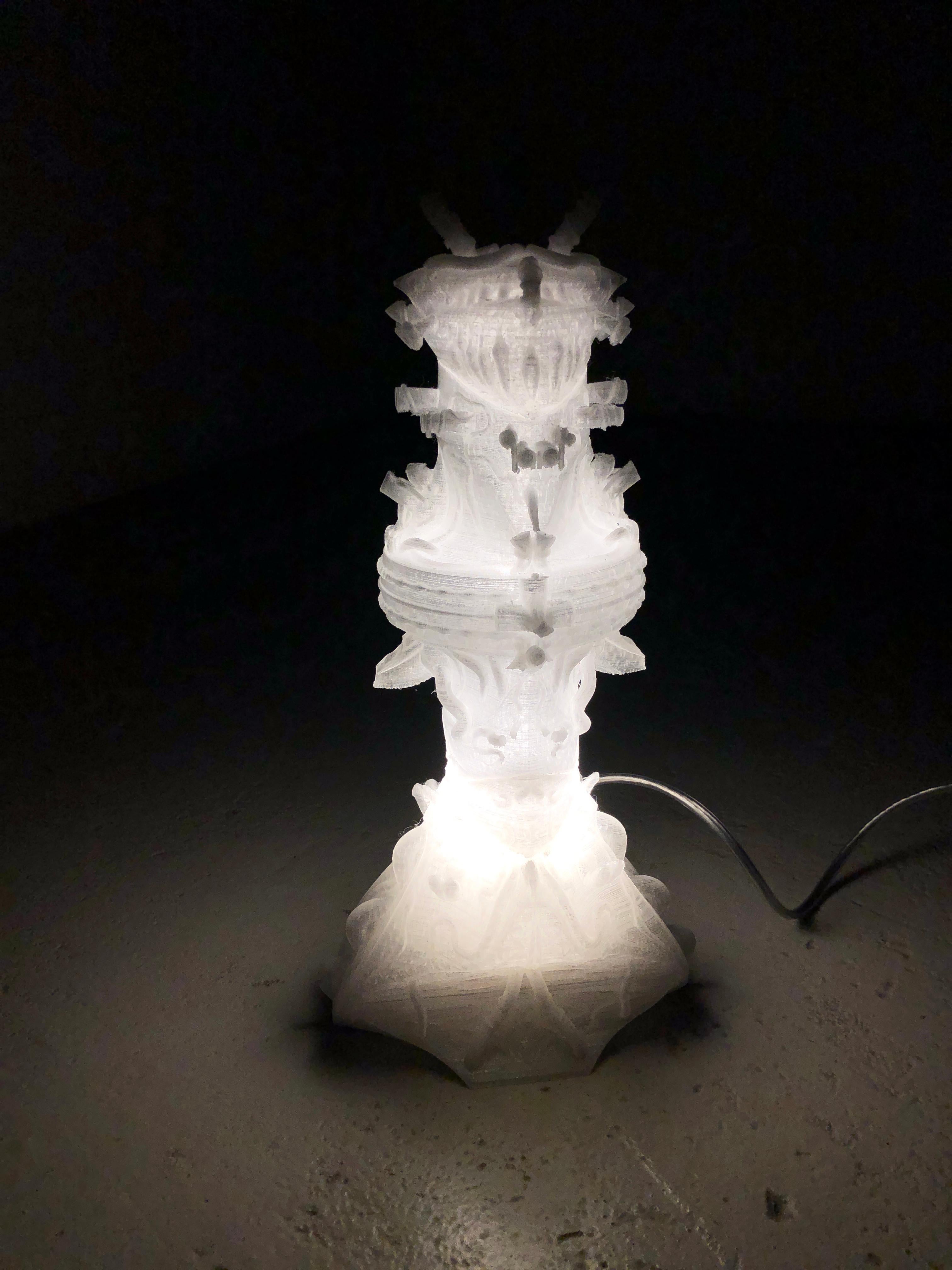 Ornamented Lamp, 3D printed in four parts. 
The expressive outer is accompanied by a subtle light, high lighting the details. The lamp can be dissembled in two parts, allowing one to change the lightbulb. Comes with a europlug as default. 

