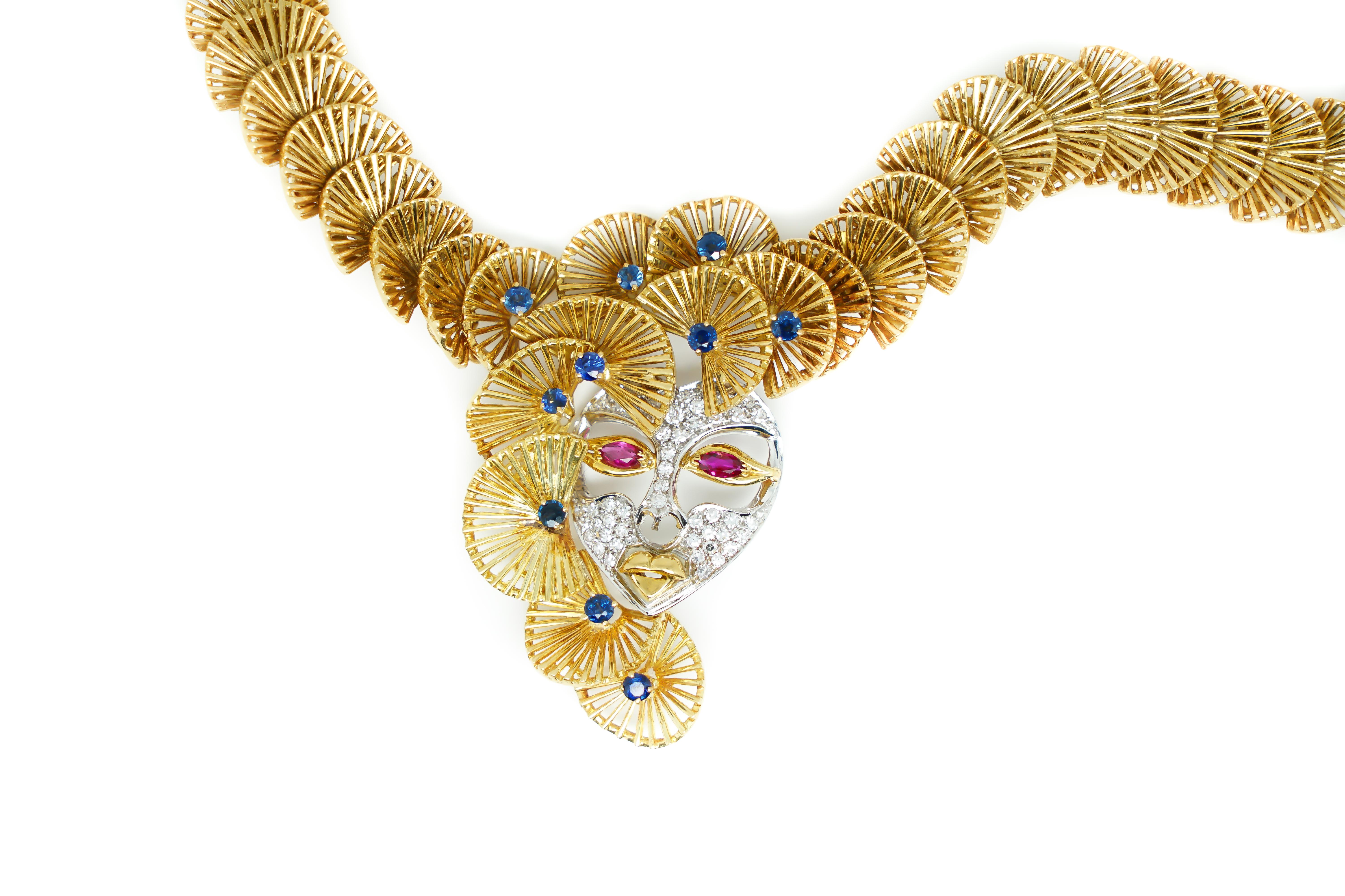 Art Deco Ornamental Necklace 18 Karat Gold, Sapphires and a Mask with Rubies and Diamonds For Sale